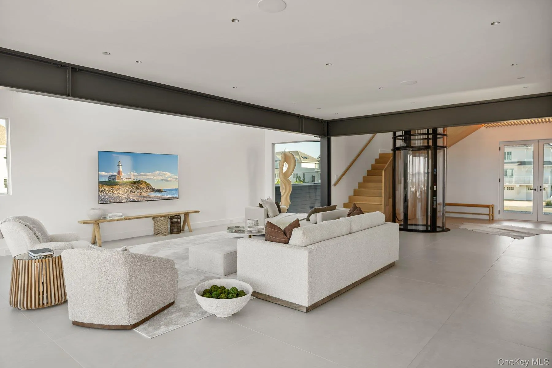 Living room with stairs and french doors Living room with stairs and french doors