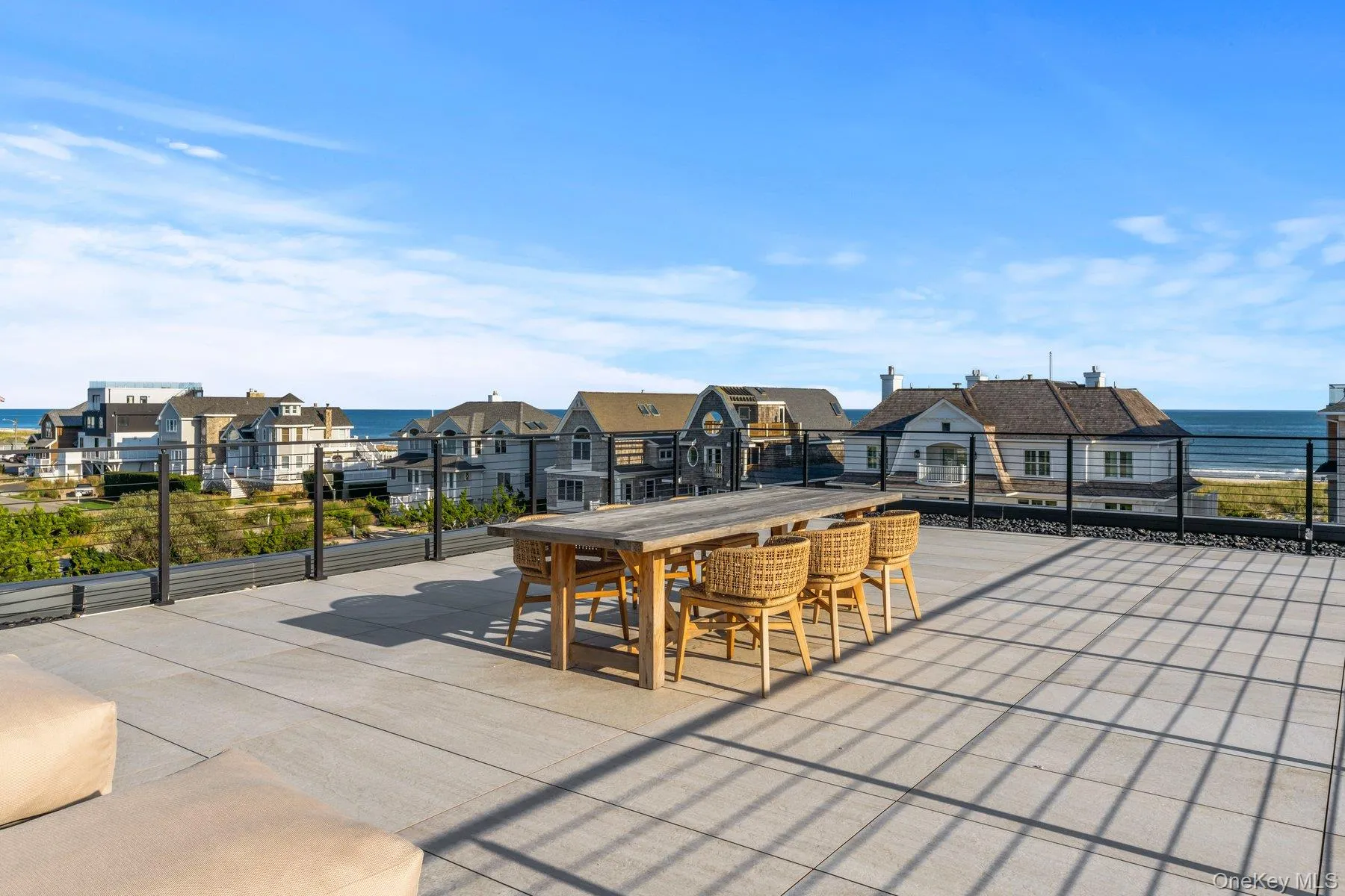View of patio / terrace featuring a water view, a residential view, and outdoor dining space View of patio / terrace featuring a water view, a residential view, and outdoor dining space