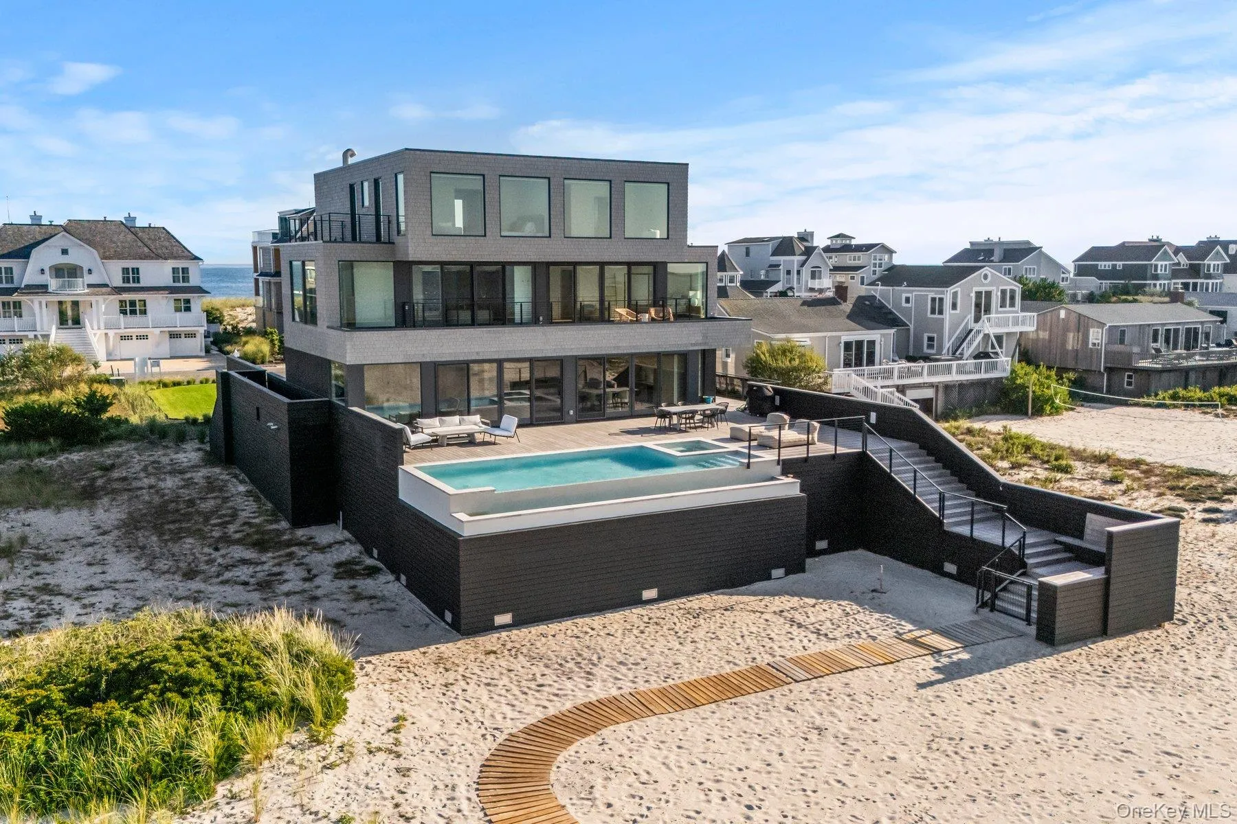 Back of property with a patio area, a residential view, stairs, a balcony, and a fenced backyard Back of property with a patio area, a residential view, stairs, a balcony, and a fenced backyard