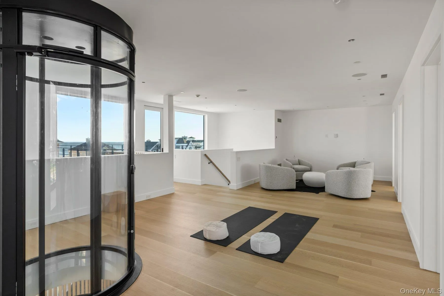 Workout room featuring light wood-style floors and baseboards Workout room featuring light wood-style floors and baseboards
