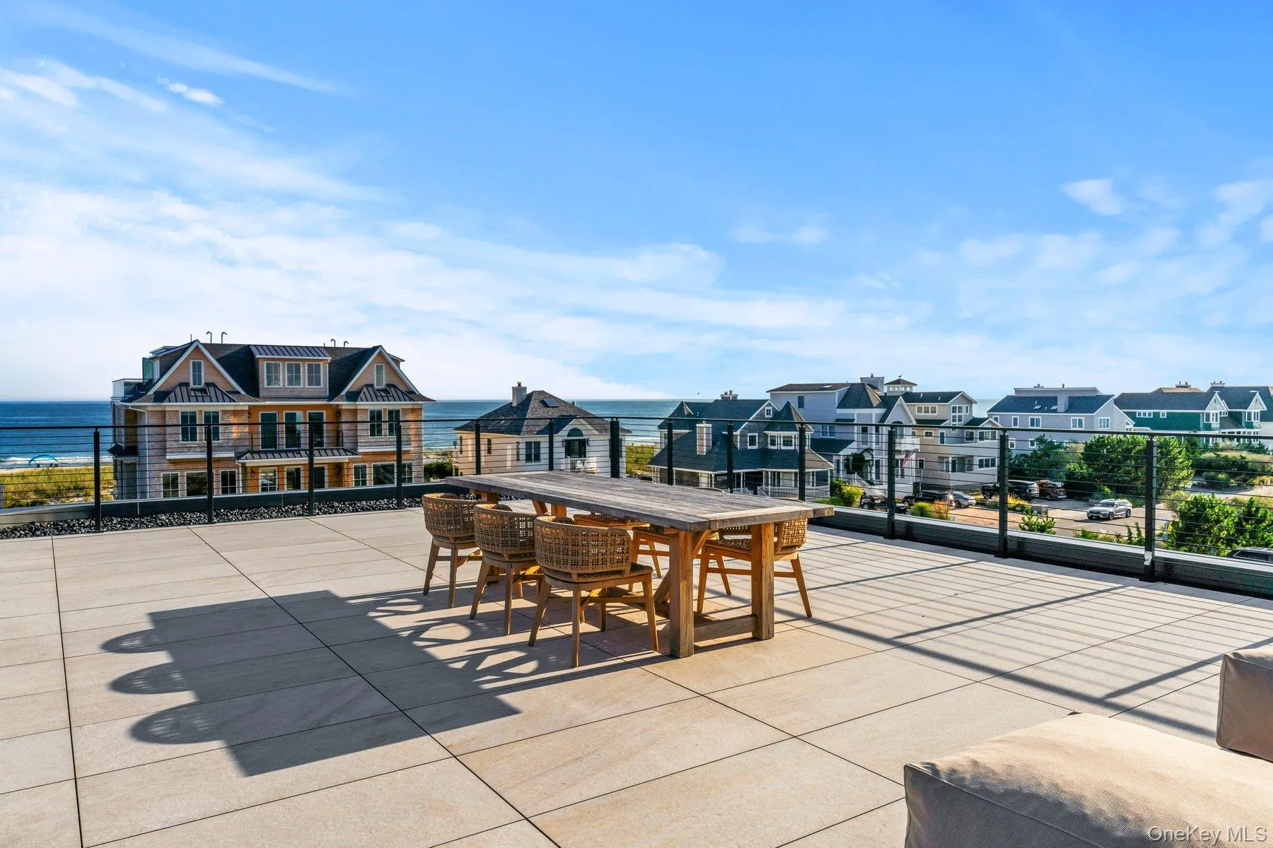 View of patio / terrace with outdoor dining area and a residential view View of patio / terrace with outdoor dining area and a residential view