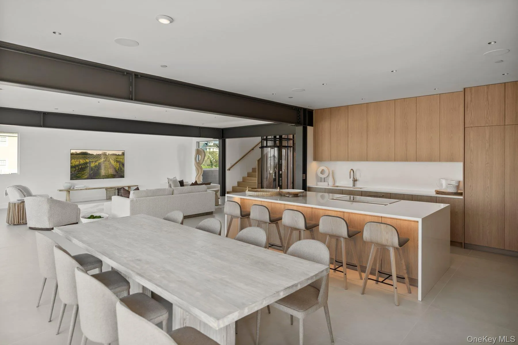 Dining room with stairway, baseboard heating, and recessed lighting Dining room with stairway, baseboard heating, and recessed lighting