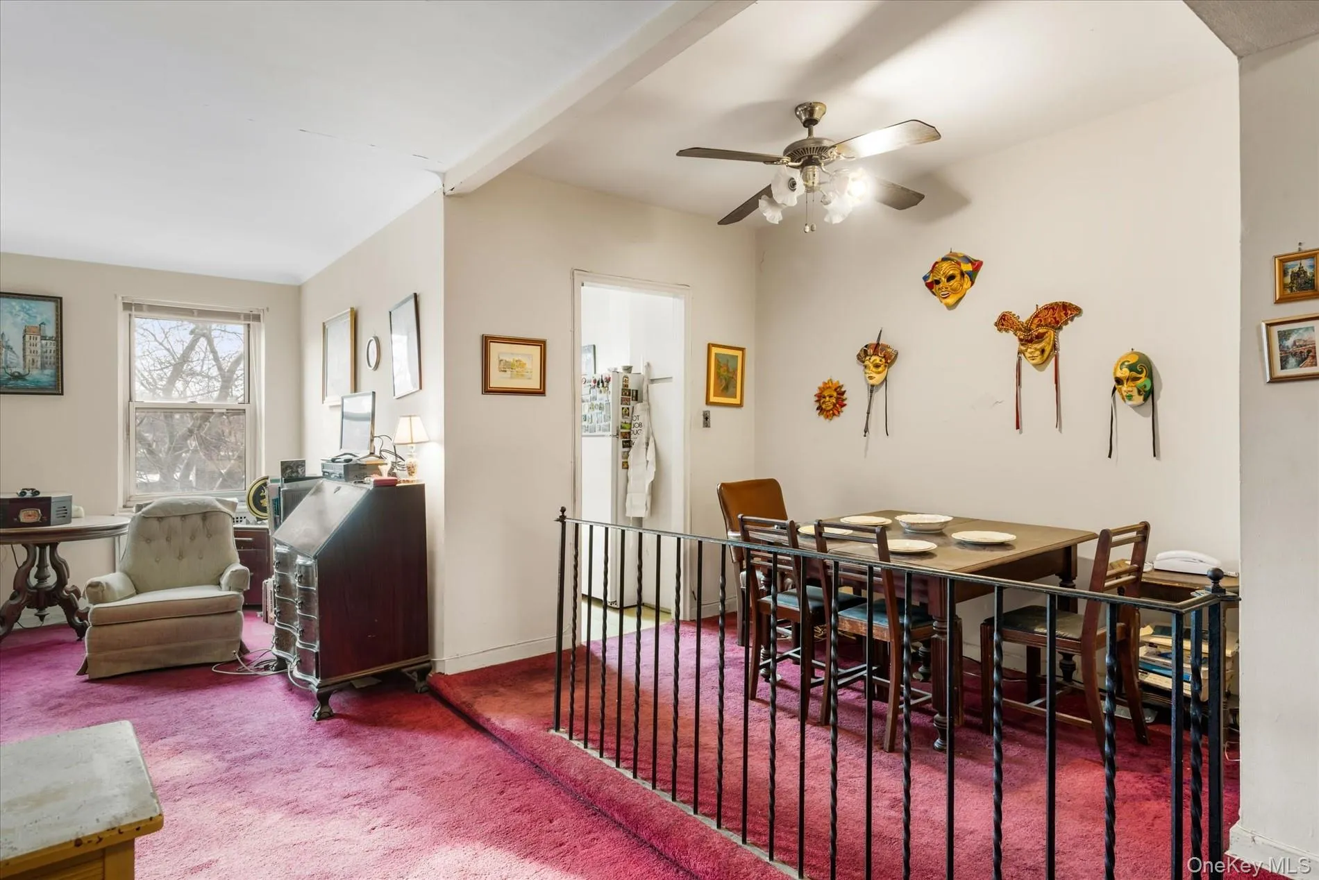 Carpeted dining area featuring ceiling fan and baseboards Carpeted dining area featuring ceiling fan and baseboards