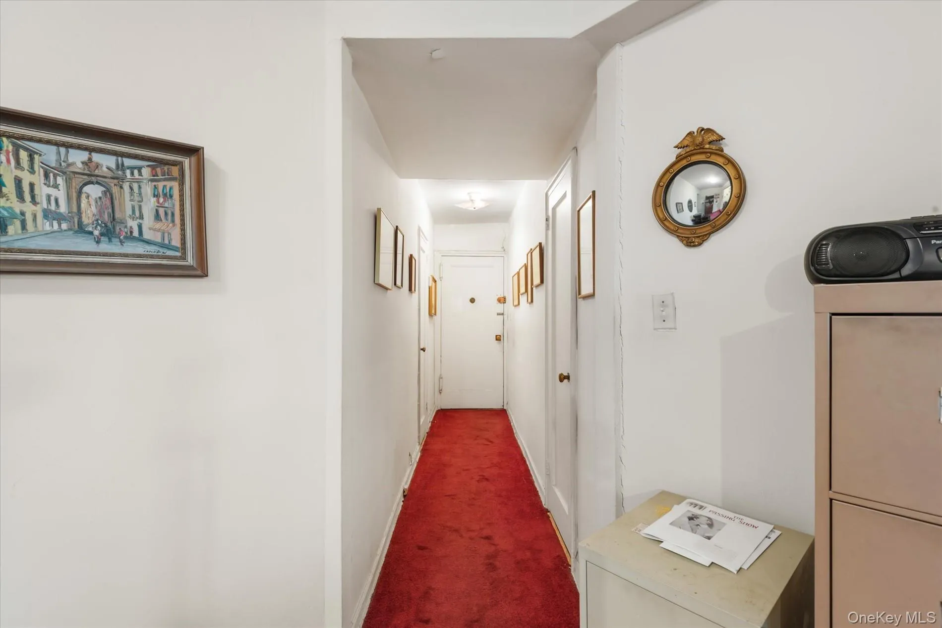 Hallway featuring carpet and baseboards Hallway featuring carpet and baseboards