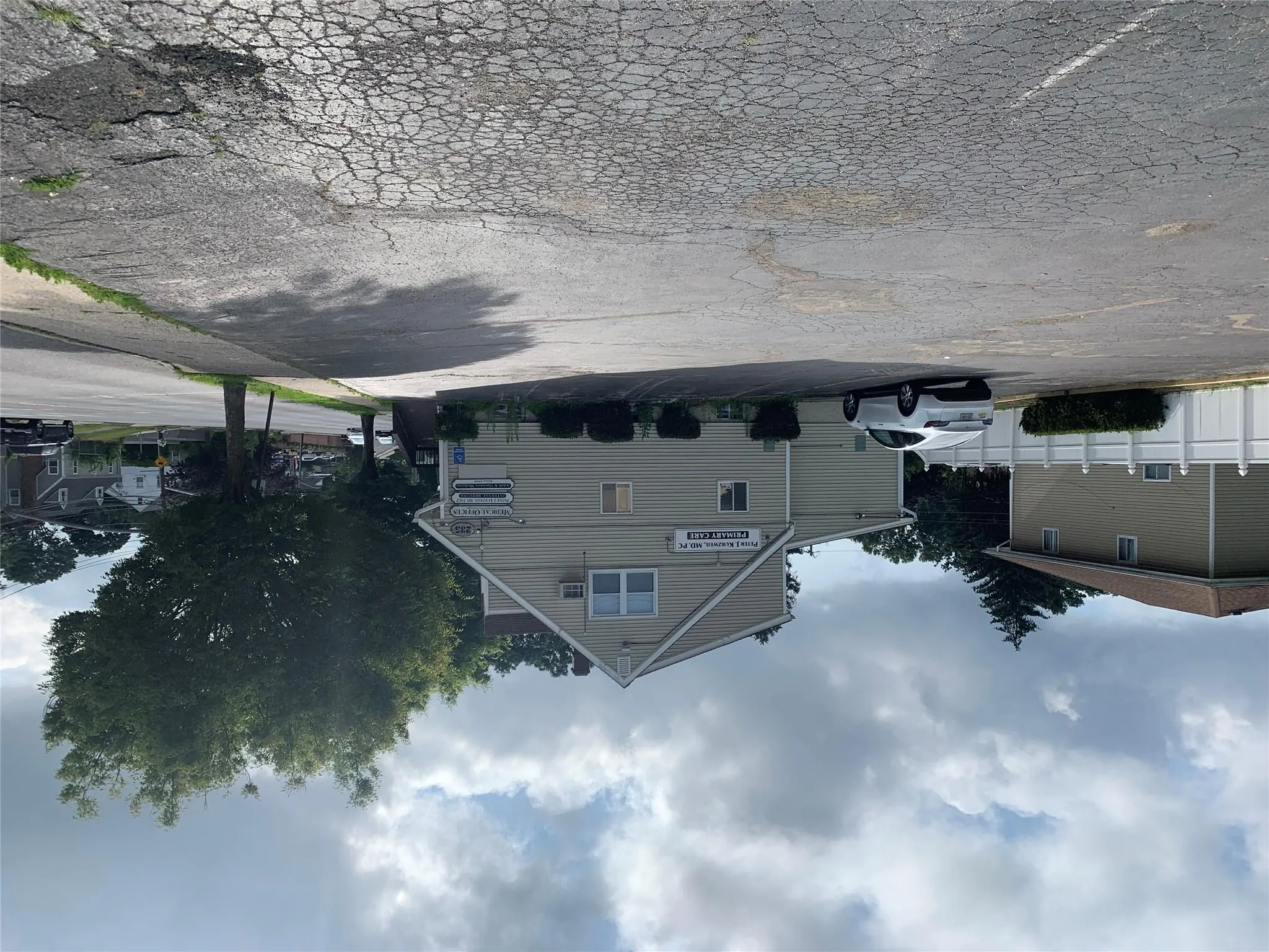 View of side of property with uncovered parking View of side of property with uncovered parking