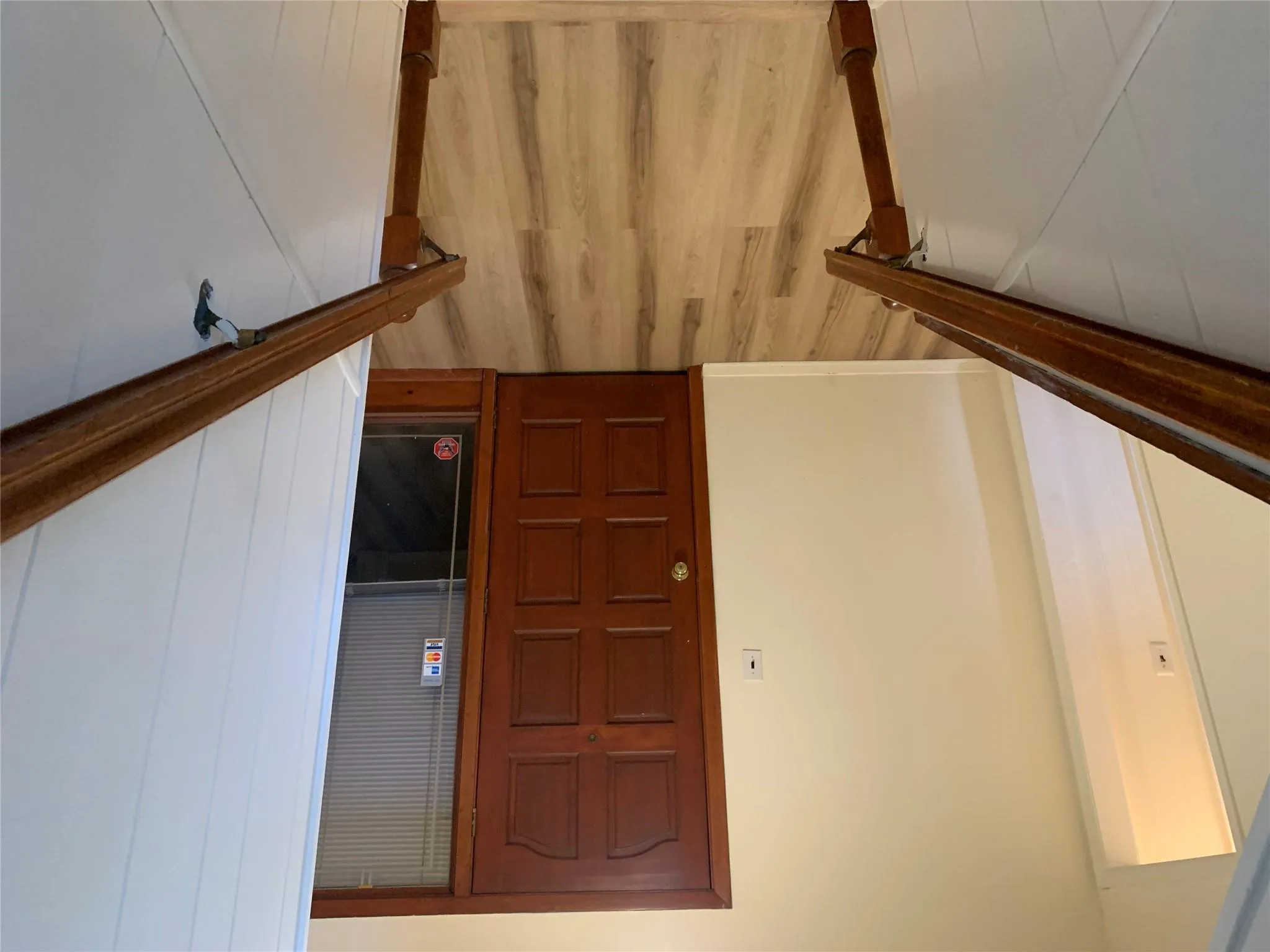 Staircase with wood finished floors and baseboards Staircase with wood finished floors and baseboards