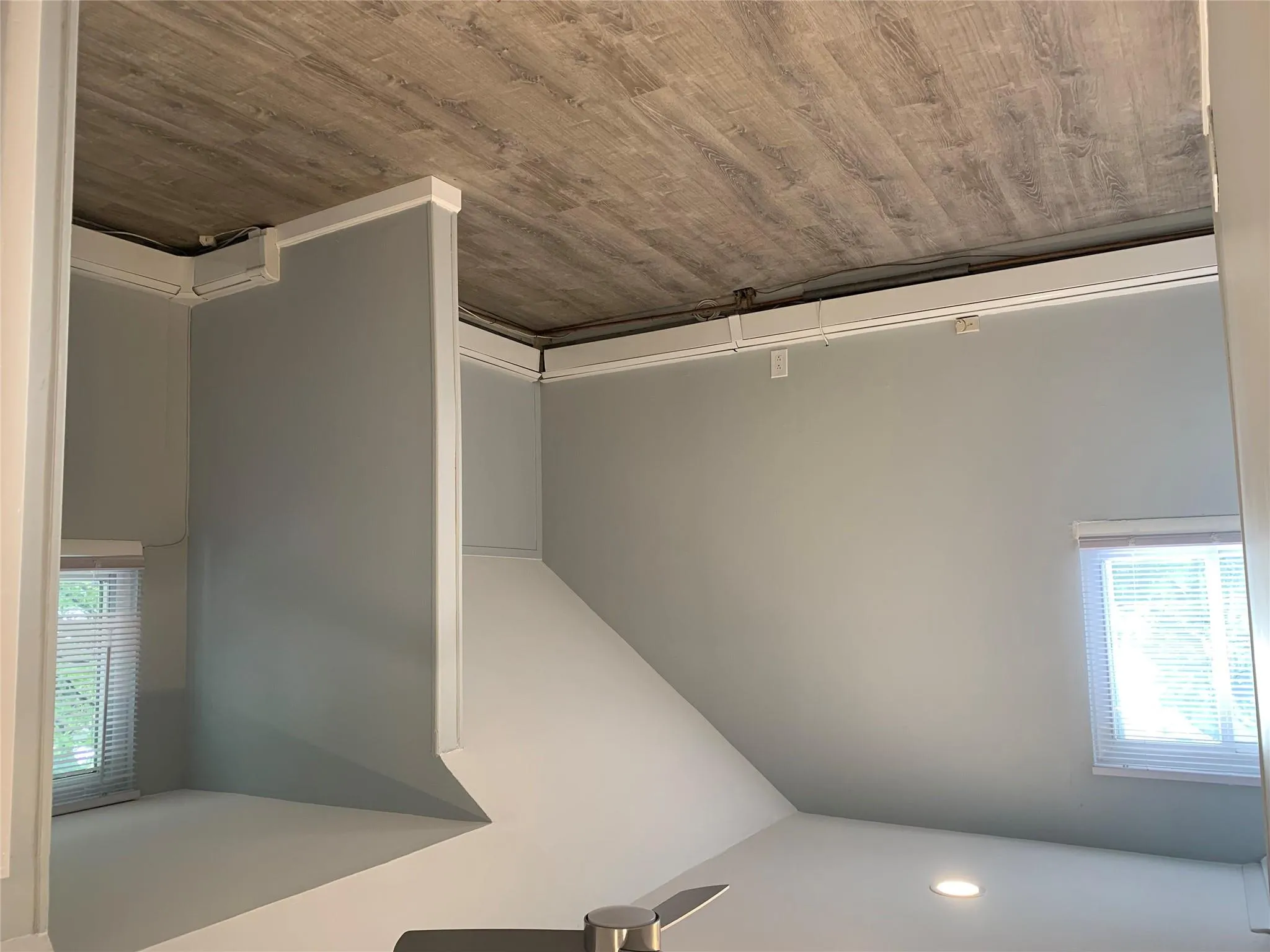 Bonus room with a ceiling fan, a baseboard radiator, healthy amount of natural light, wood finished floors, and lofted ceiling Bonus room with a ceiling fan, a baseboard radiator, healthy amount of natural light, wood finished floors, and lofted ceiling