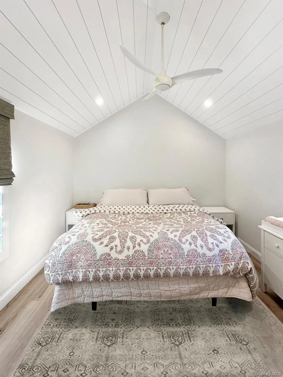 Bedroom with lofted ceiling, wood ceiling, baseboards, and wood finished floors Bedroom with lofted ceiling, wood ceiling, baseboards, and wood finished floors