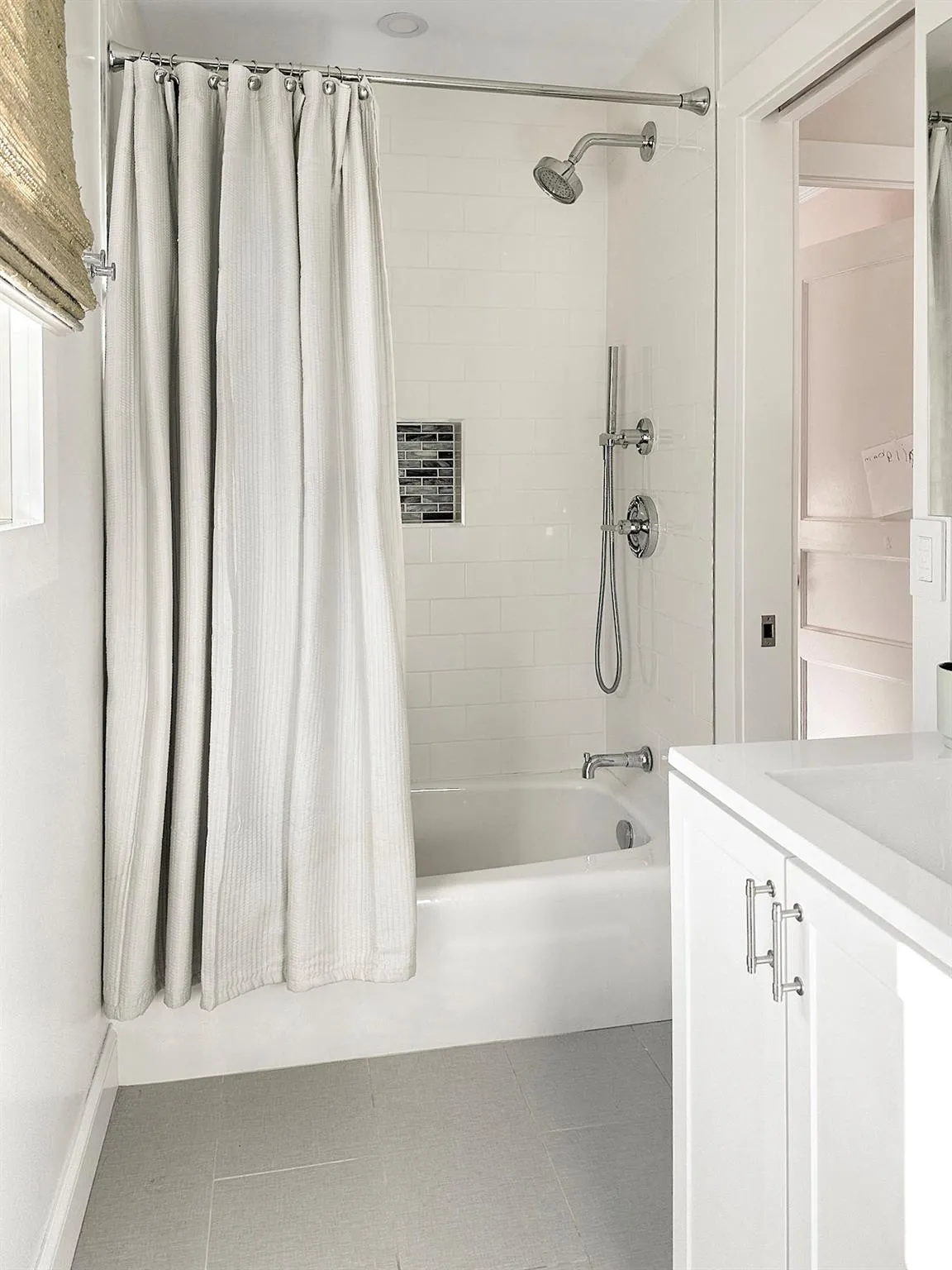 Full bath with shower / tub combo, vanity, and tile patterned floors Full bath with shower / tub combo, vanity, and tile patterned floors