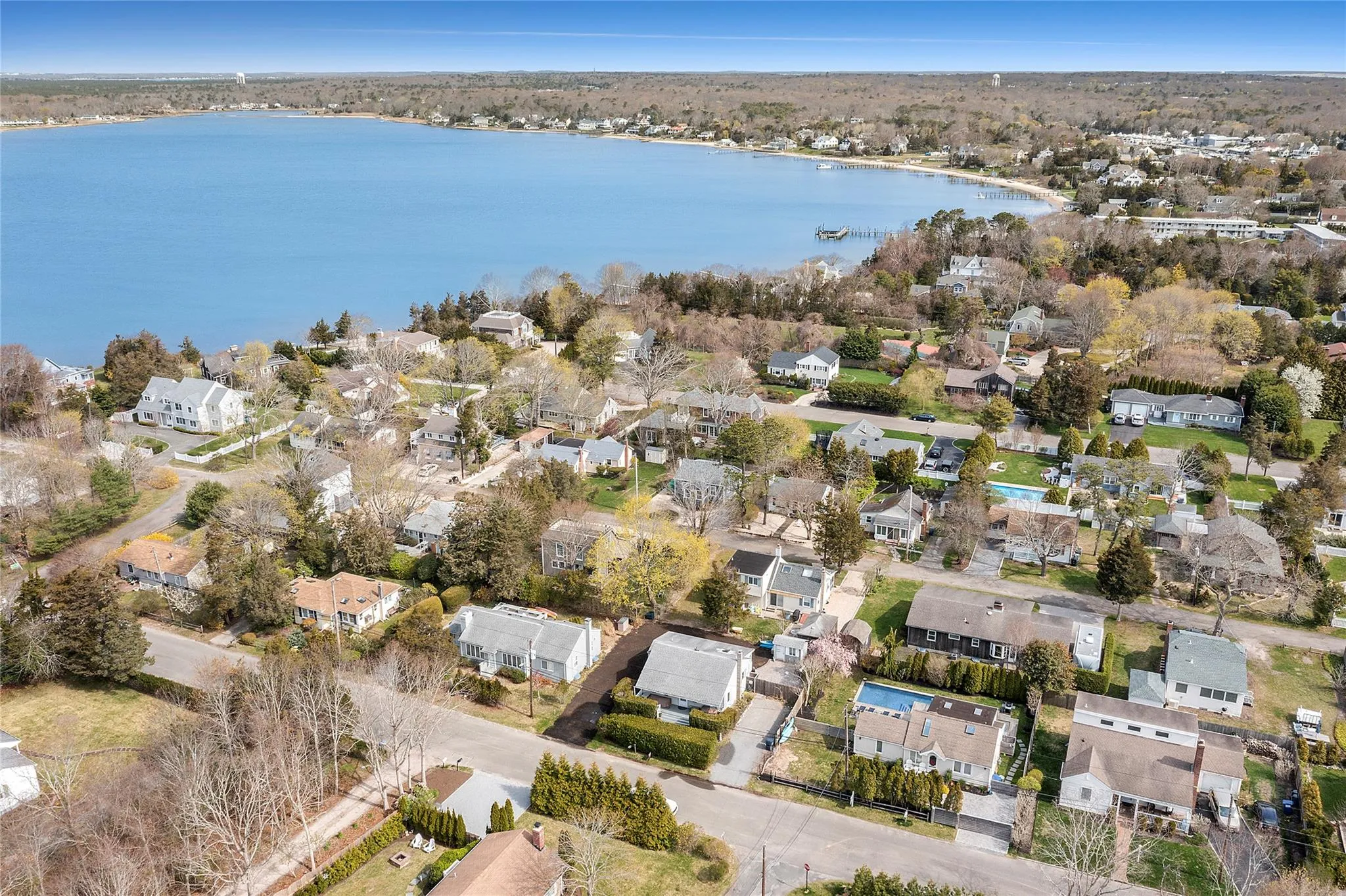 Aerial view featuring a water view and a residential view Aerial view featuring a water view and a residential view