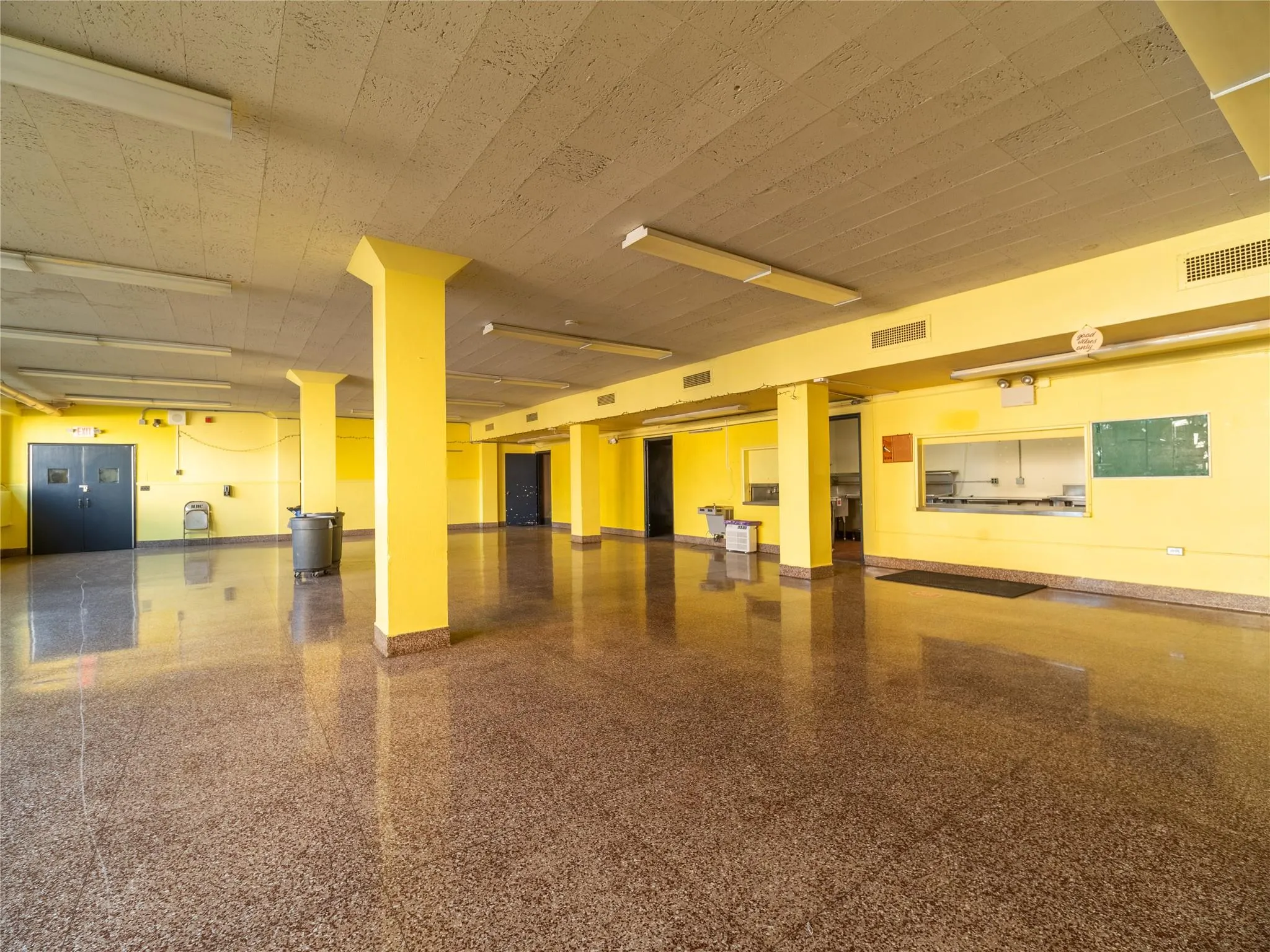 Garage featuring baseboards and visible vents Garage featuring baseboards and visible vents