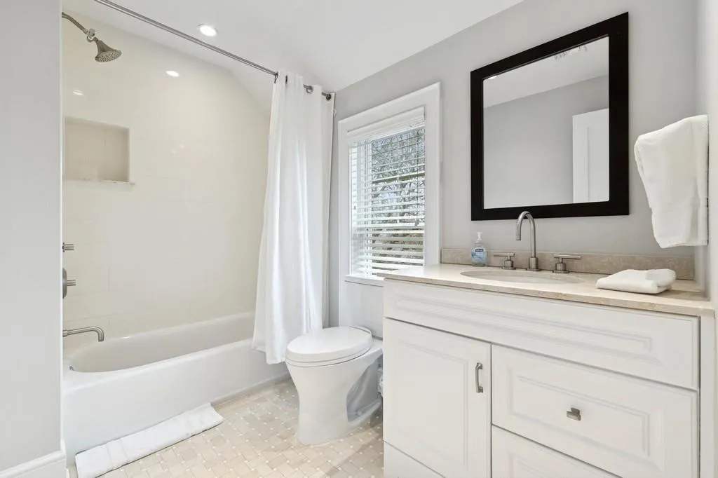 Full bathroom with tile patterned flooring, toilet, recessed lighting, shower / bath combination with curtain, and vanity Full bathroom with tile patterned flooring, toilet, recessed lighting, shower / bath combination with curtain, and vanity