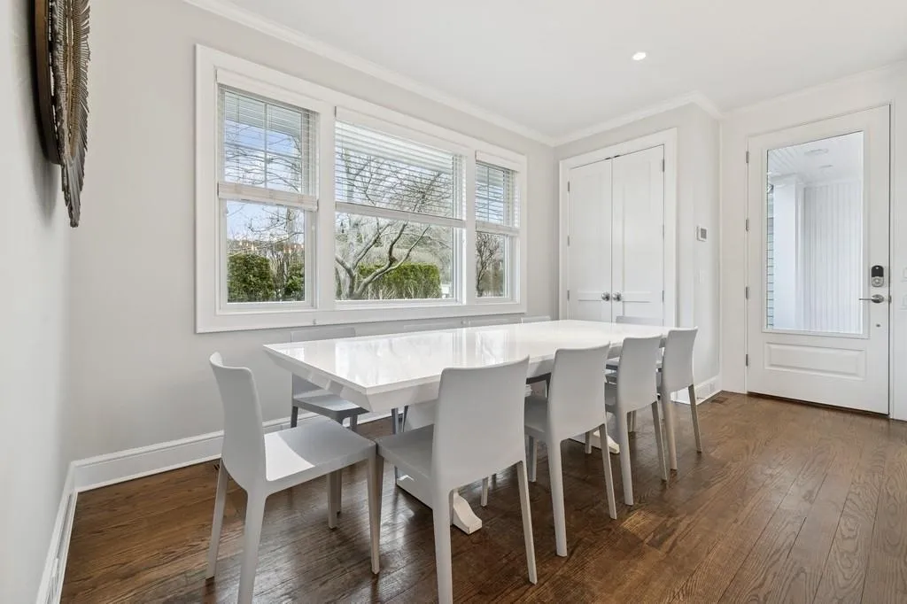 Dining room featuring recessed lighting, dark wood-style floors, baseboards, and ornamental molding Dining room featuring recessed lighting, dark wood-style floors, baseboards, and ornamental molding