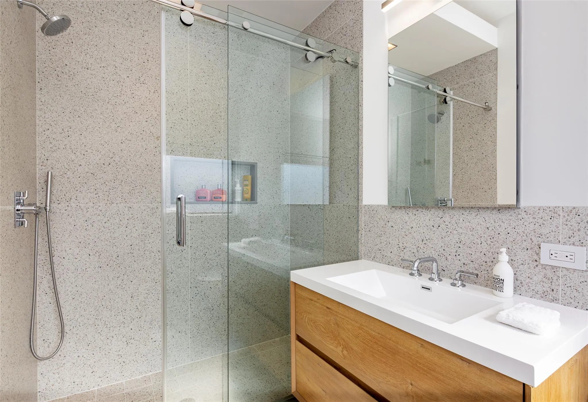 Full bath with vanity, a shower stall, tile walls, and tasteful backsplash Full bath with vanity, a shower stall, tile walls, and tasteful backsplash