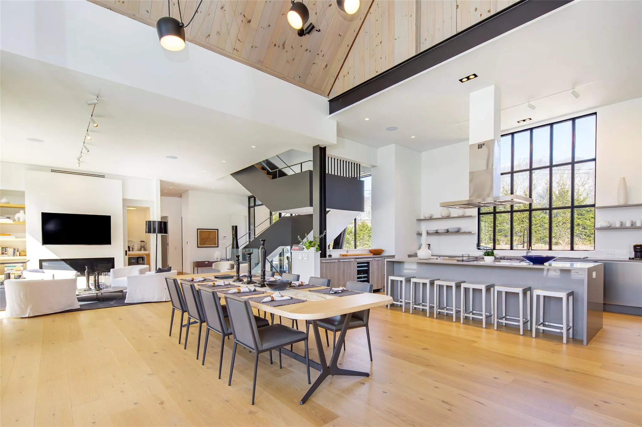 Dining space featuring wood ceiling, track lighting, high vaulted ceiling, and light wood-type flooring Dining space featuring wood ceiling, track lighting, high vaulted ceiling, and light wood-type flooring