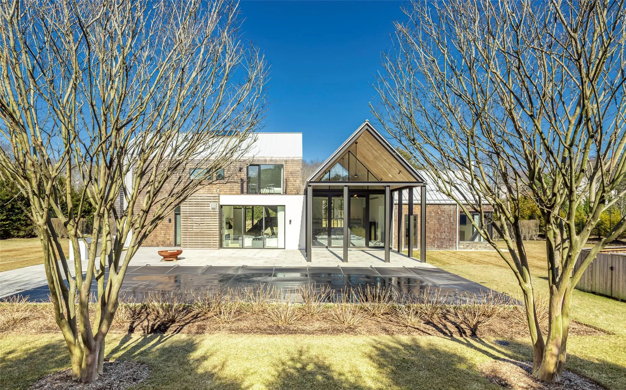 Back of house featuring a yard and a patio Back of house featuring a yard and a patio