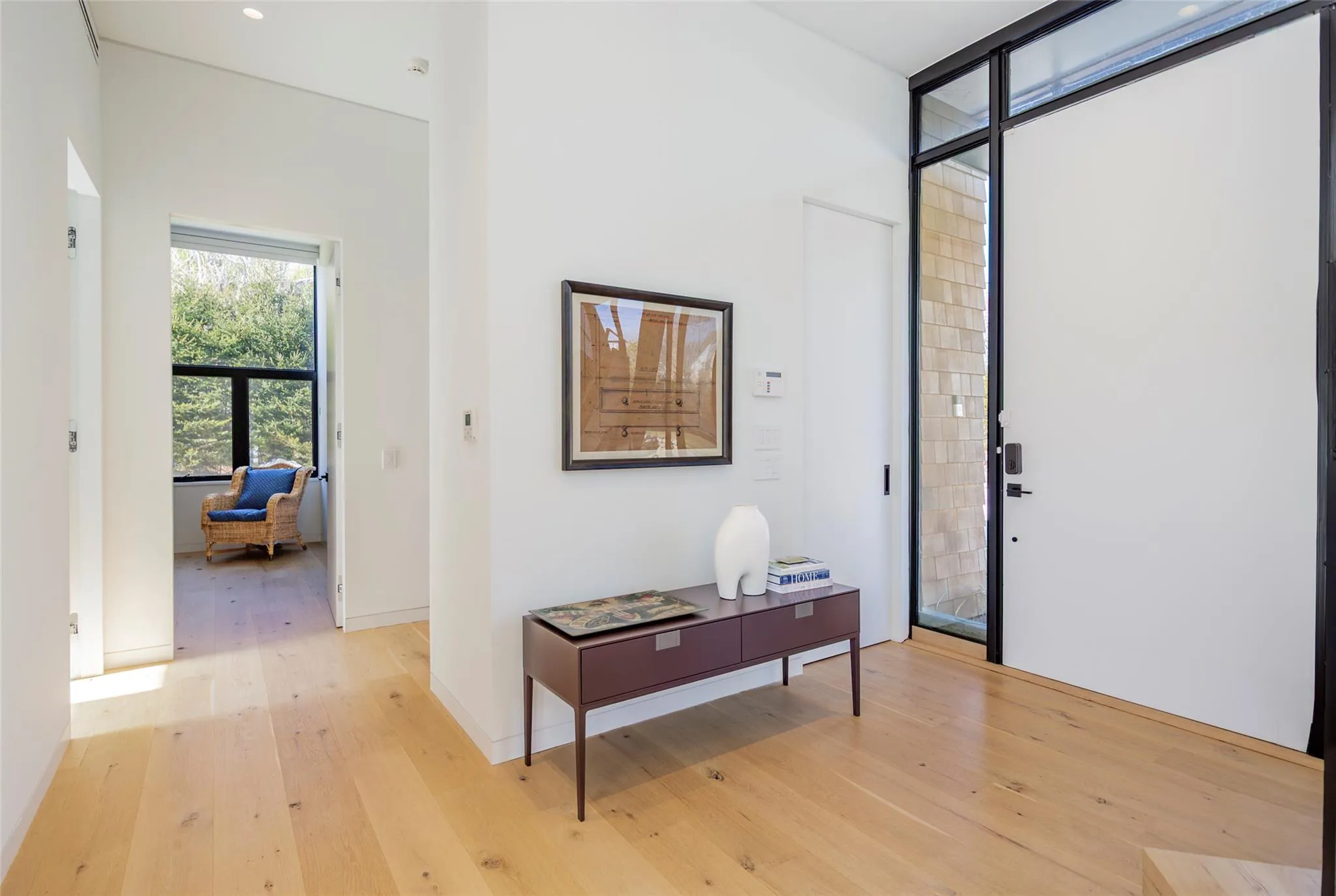 Entryway featuring light wood finished floors Entryway featuring light wood finished floors