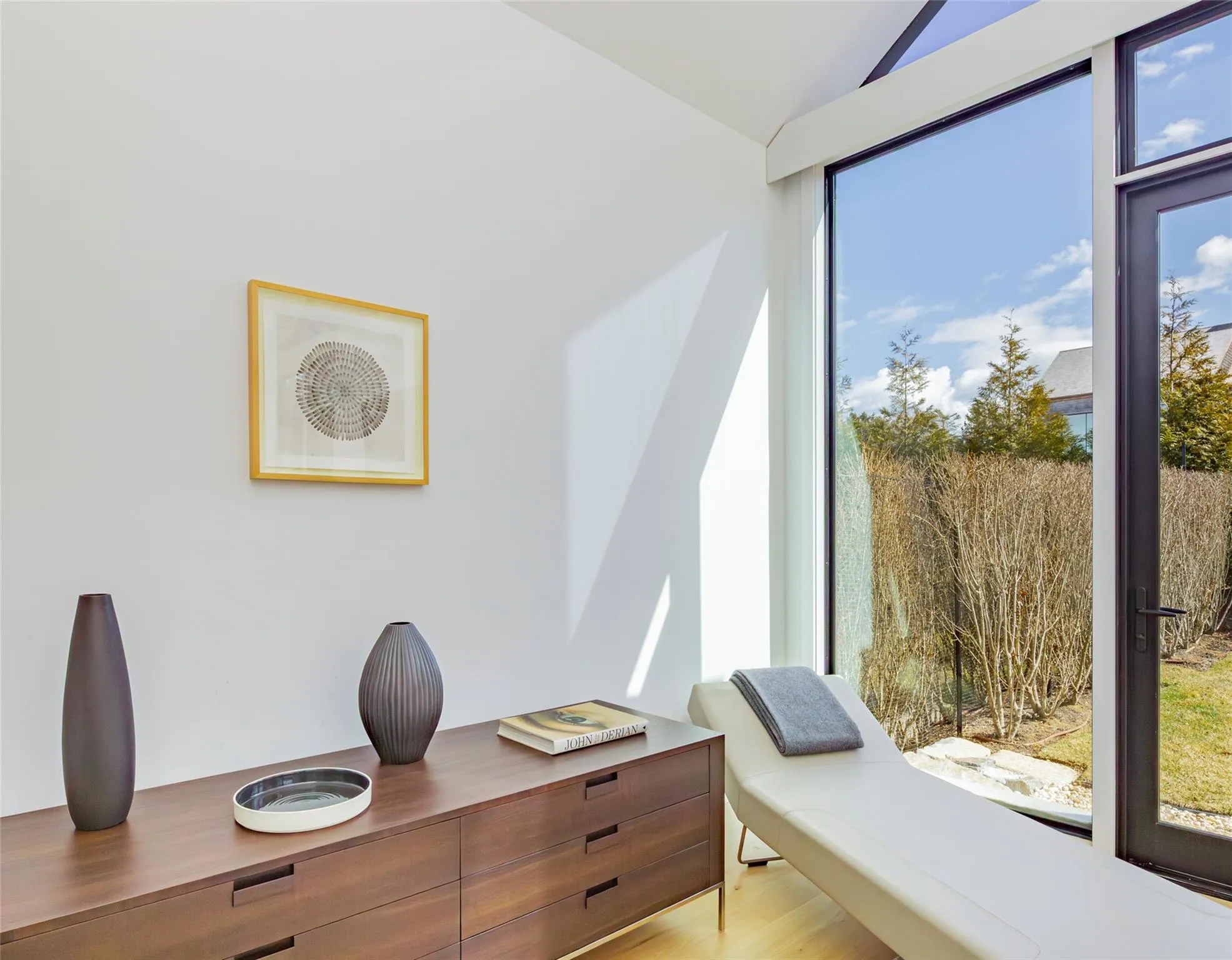 Home office featuring lofted ceiling and light wood-style floors Home office featuring lofted ceiling and light wood-style floors