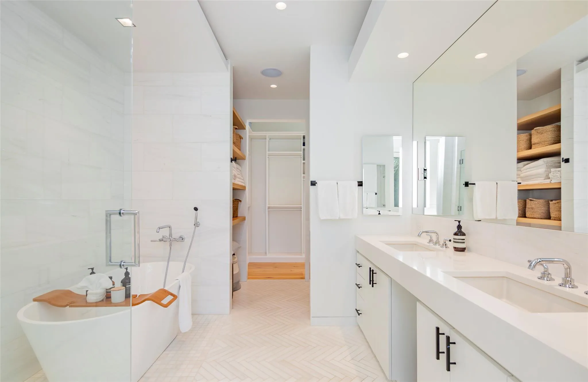Full bath featuring a soaking tub, recessed lighting, double vanity, and a sink Full bath featuring a soaking tub, recessed lighting, double vanity, and a sink