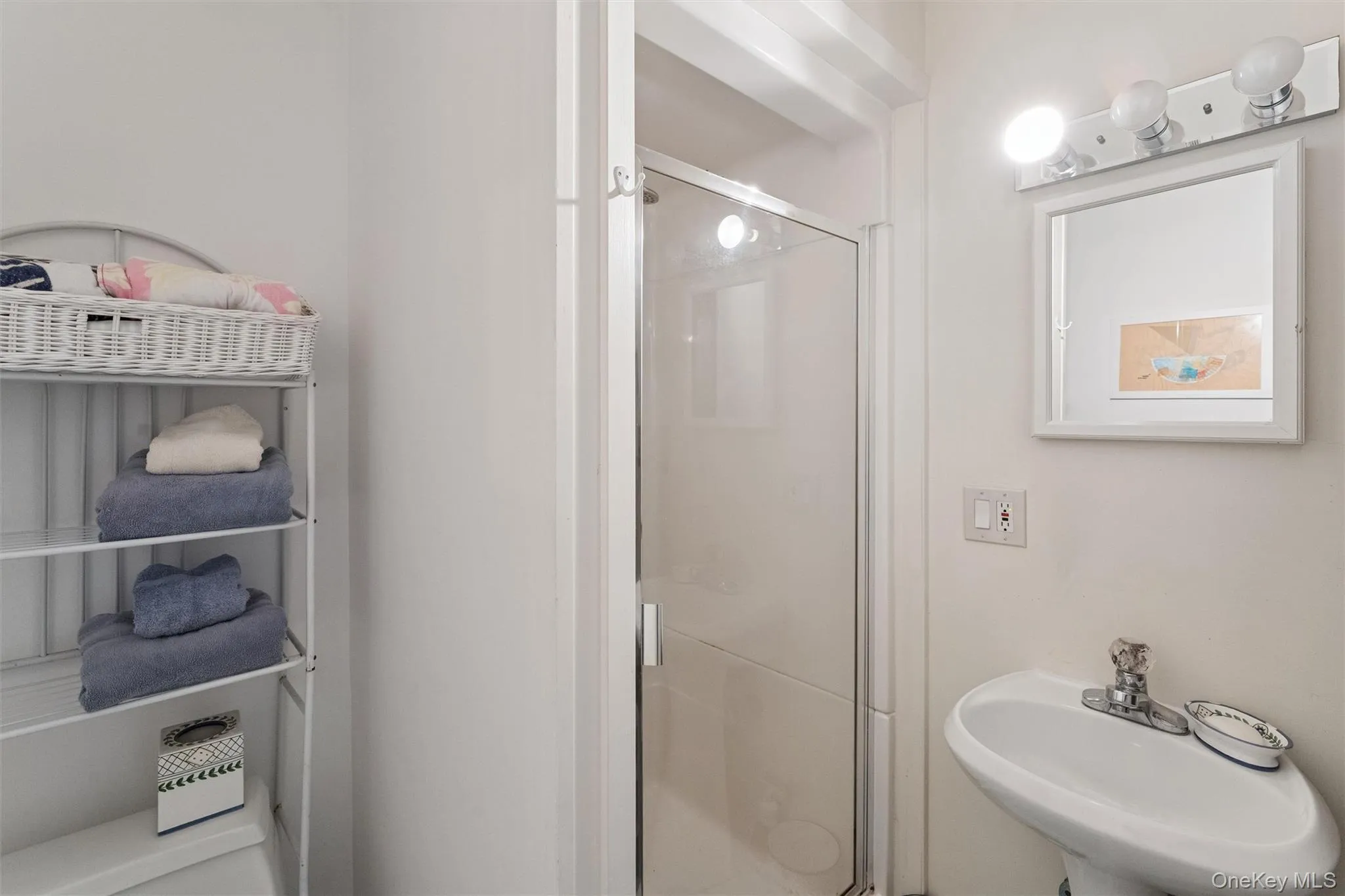 Bathroom with a sink and a stall shower Bathroom with a sink and a stall shower