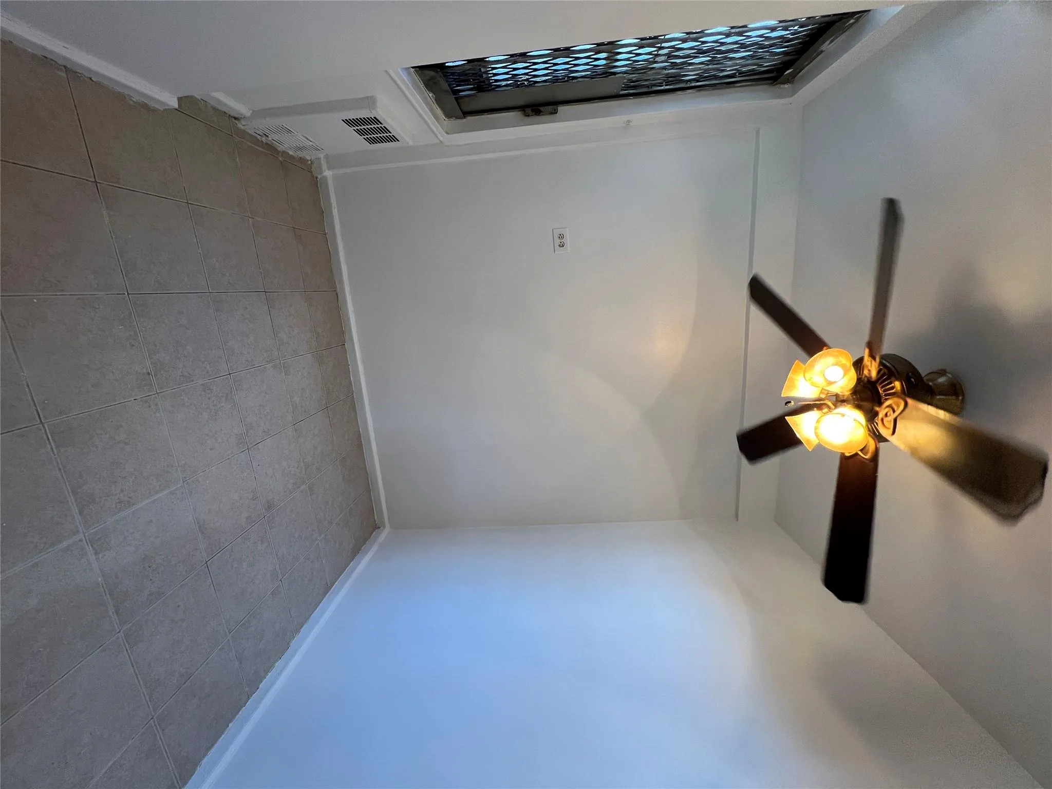 Spare room featuring visible vents, baseboards, and ceiling fan Spare room featuring visible vents, baseboards, and ceiling fan