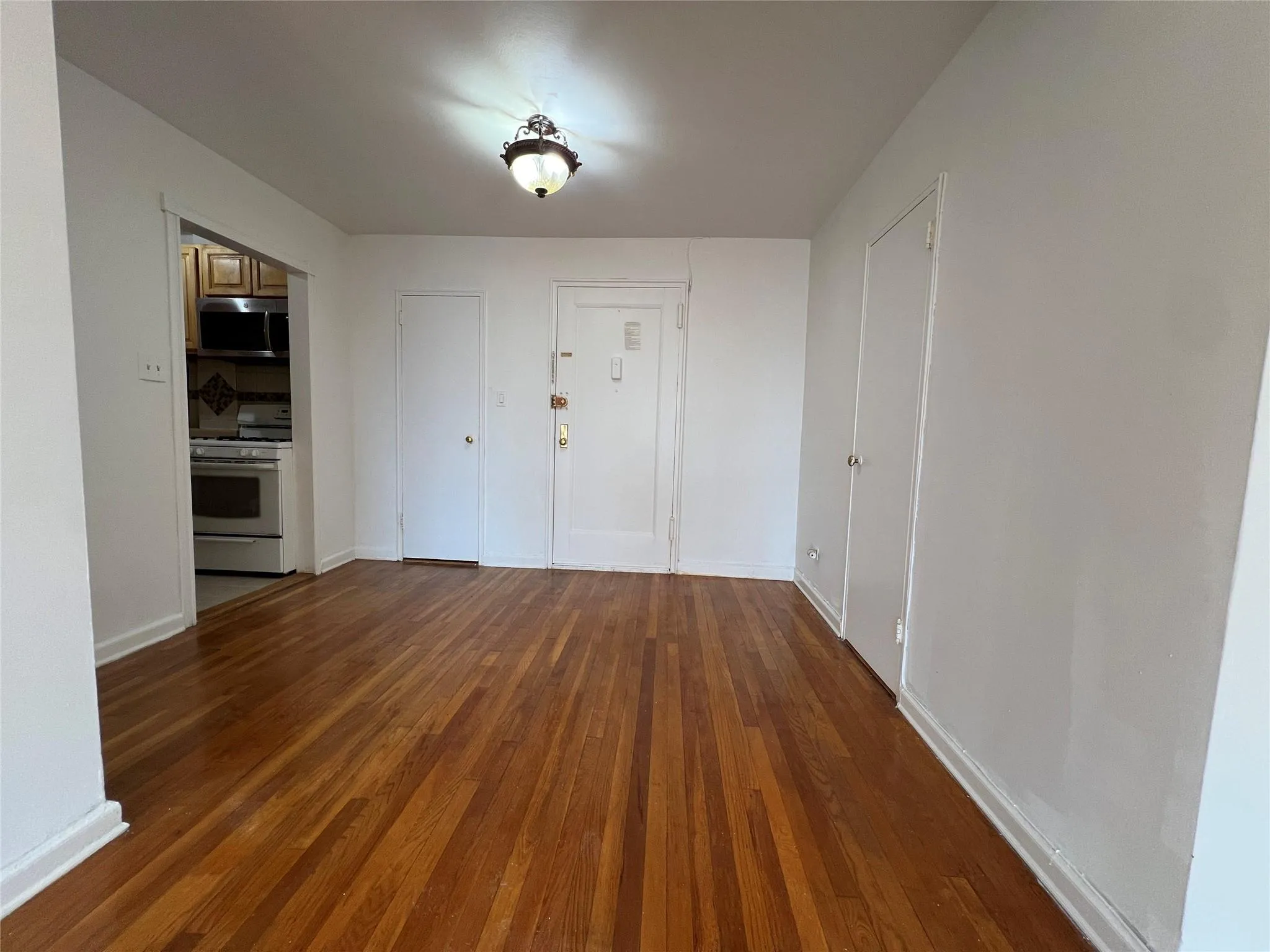 Entryway with baseboards and hardwood floors Entryway with baseboards and hardwood floors