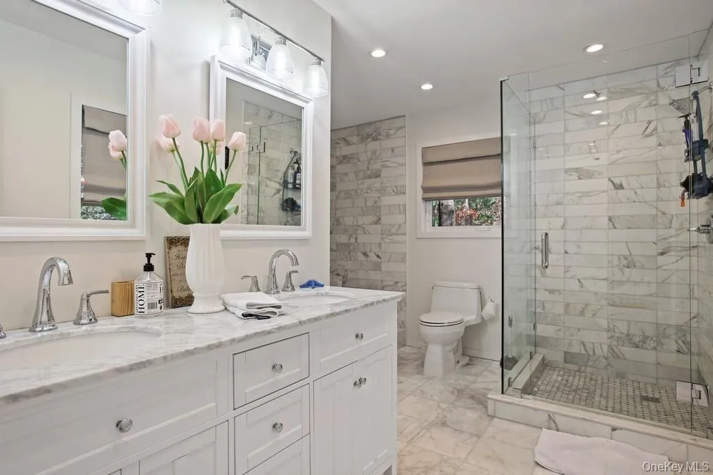 En Suite Master Bathroom. Carrera Marble, Stand Up Shower plus a Spa Tub w/ Jets En Suite Master Bathroom. Carrera Marble, Stand Up Shower plus a Spa Tub w/ Jets