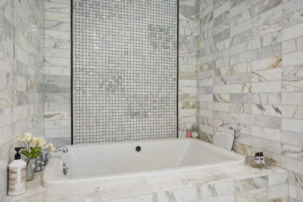 En Suite Master Bathroom. Carrera Marble, Stand Up Shower plus a Spa Tub w/ Jets En Suite Master Bathroom. Carrera Marble, Stand Up Shower plus a Spa Tub w/ Jets