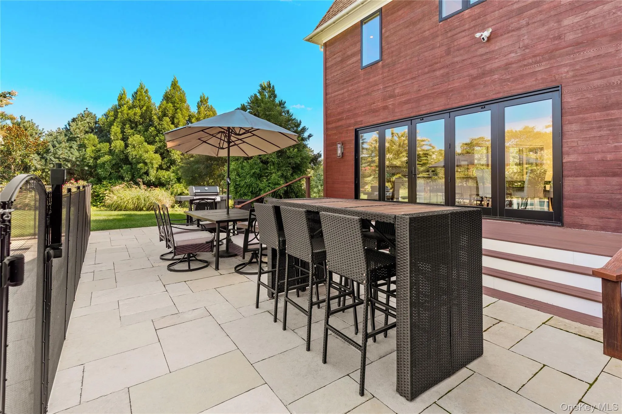 Patio / terrace featuring outdoor dry bar and outdoor dining space Patio / terrace featuring outdoor dry bar and outdoor dining space