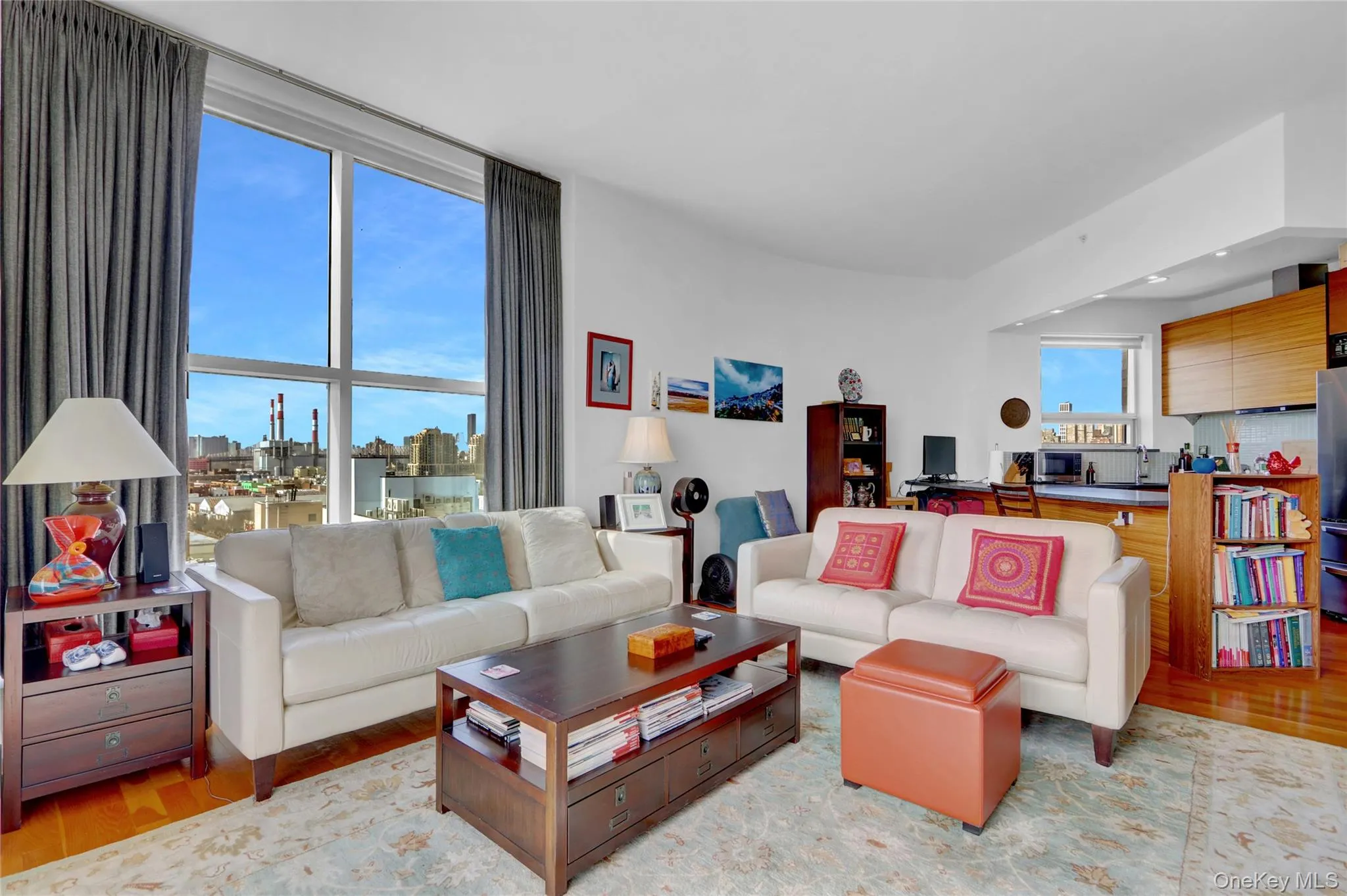 Living room with a city view and wood finished floors Living room with a city view and wood finished floors