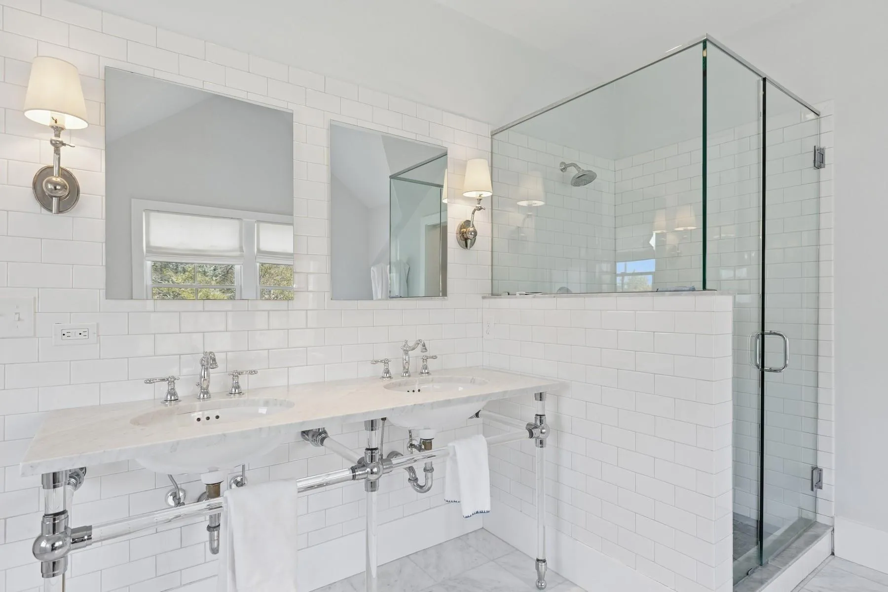 Bathroom with a sink, tasteful backsplash, and a stall shower Bathroom with a sink, tasteful backsplash, and a stall shower