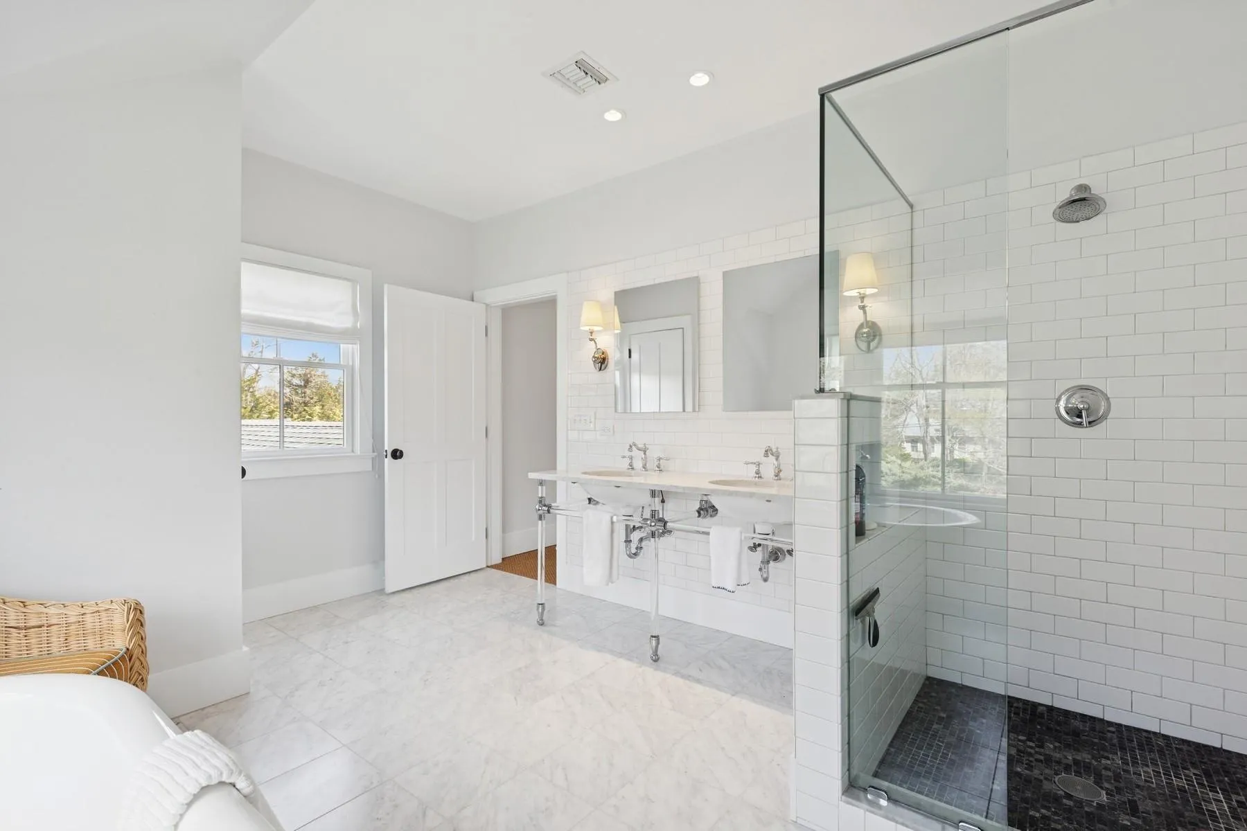 Bathroom with tile patterned floors, tasteful backsplash, baseboards, visible vents, and a shower stall Bathroom with tile patterned floors, tasteful backsplash, baseboards, visible vents, and a shower stall