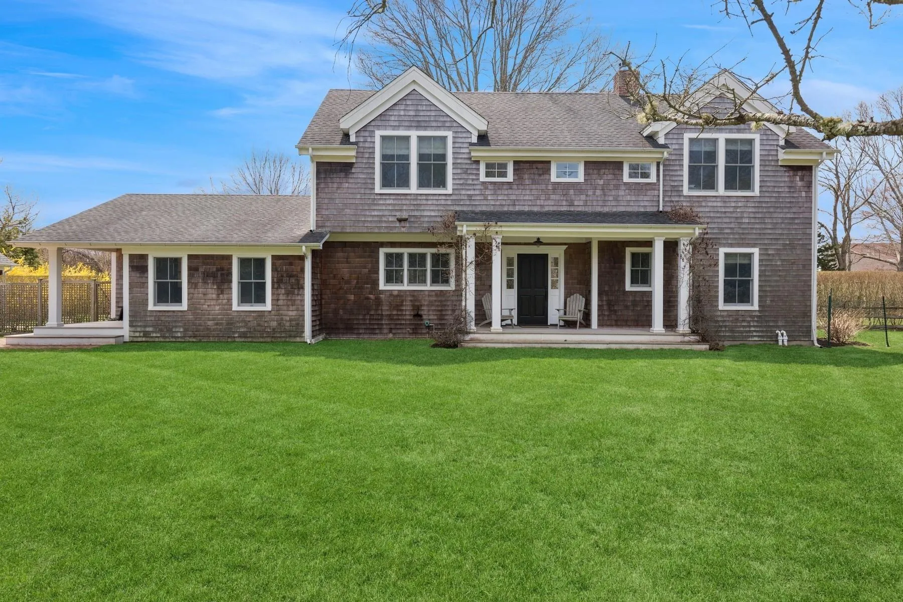 Rear view of property featuring fence, a patio area, roof with shingles, and a yard Rear view of property featuring fence, a patio area, roof with shingles, and a yard