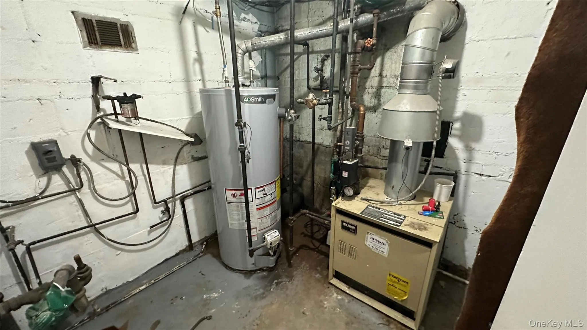 Utility room featuring gas water heater Utility room featuring gas water heater