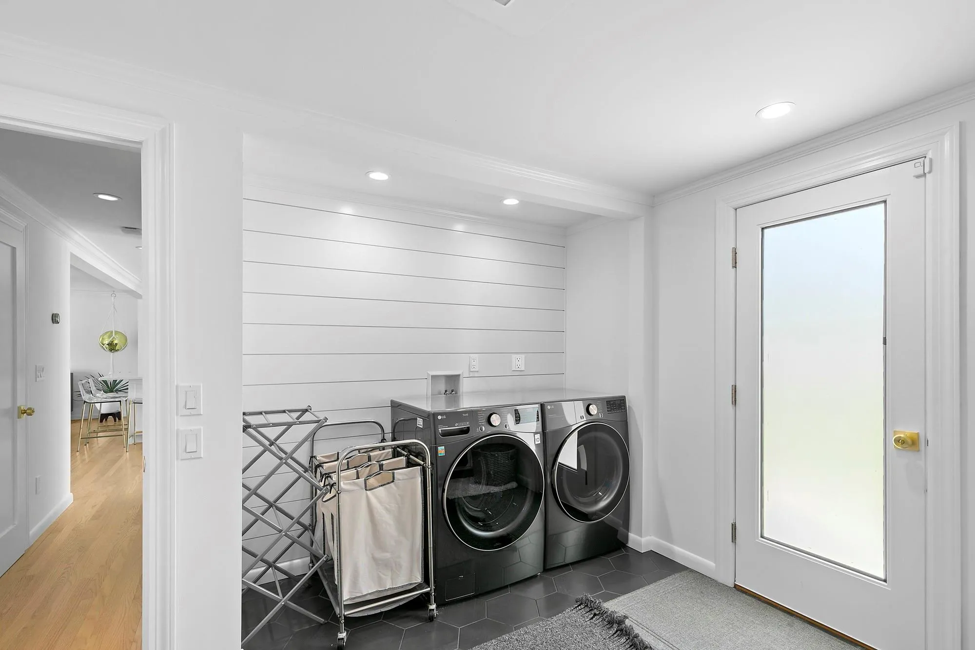 Laundry room featuring recessed lighting, washing machine and dryer, crown molding, and tile patterned flooring Laundry room featuring recessed lighting, washing machine and dryer, crown molding, and tile patterned flooring