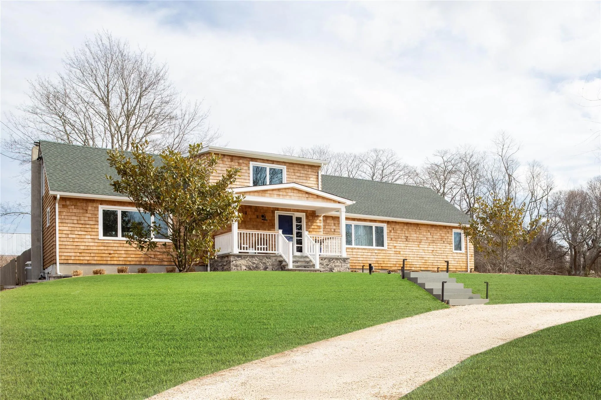 View of front of home with a porch, a chimney, a front lawn, and roof with shingles View of front of home with a porch, a chimney, a front lawn, and roof with shingles
