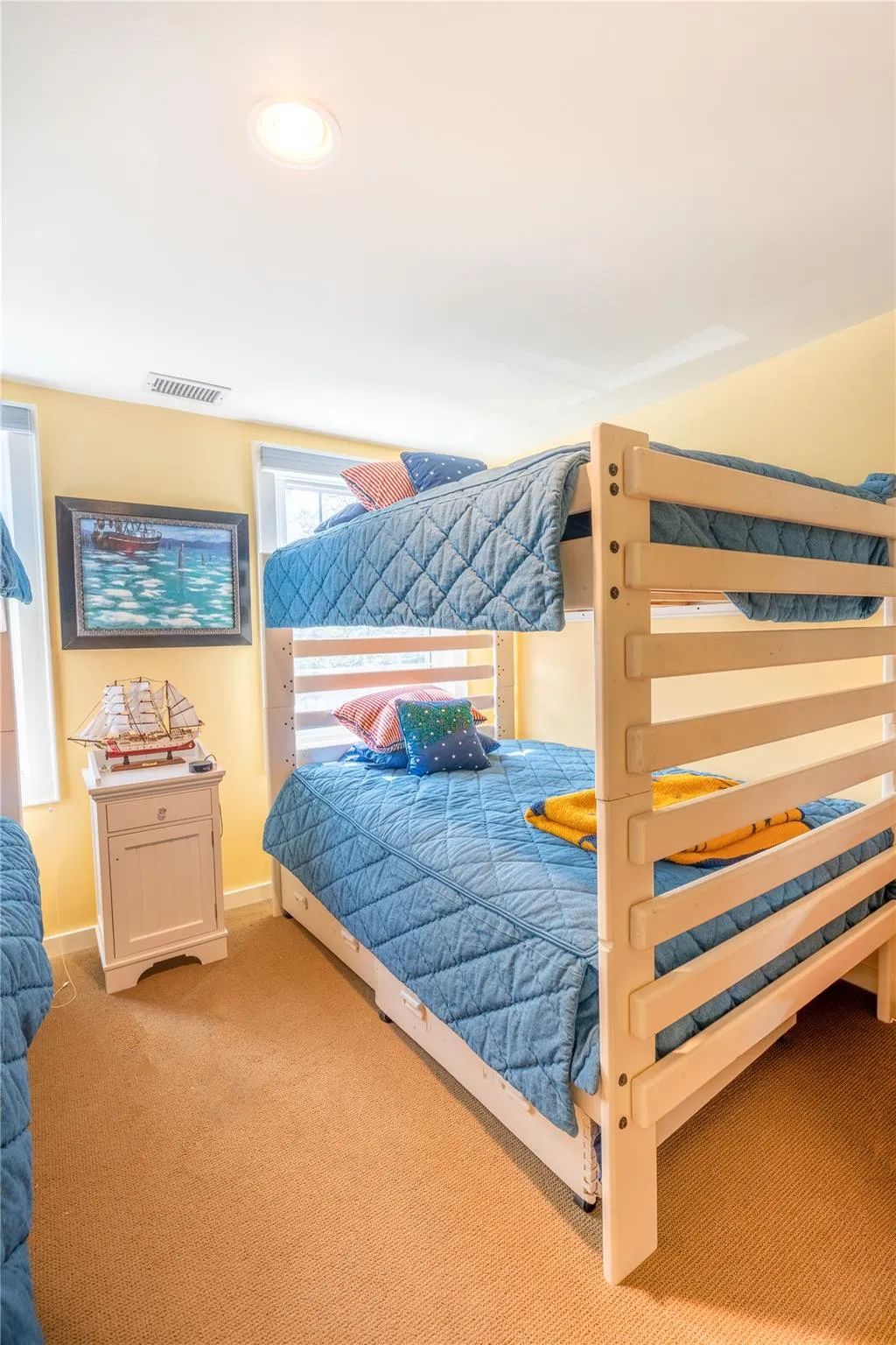 Bedroom featuring visible vents, baseboards, and carpet floors Bedroom featuring visible vents, baseboards, and carpet floors