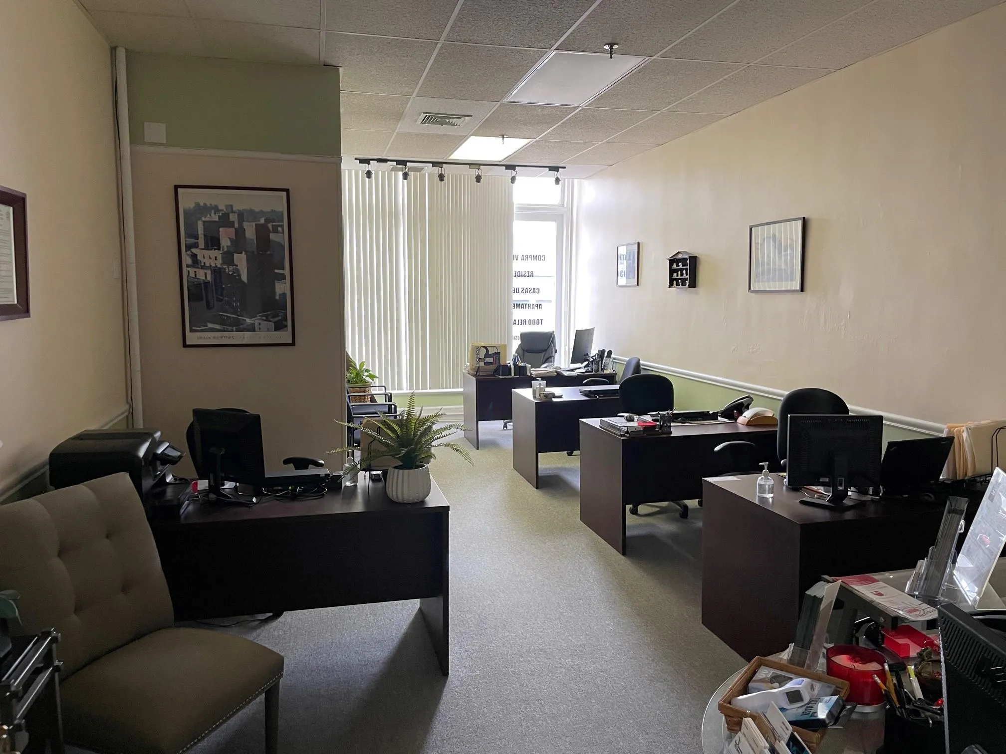 Office with carpet, visible vents, and a drop ceiling Office with carpet, visible vents, and a drop ceiling