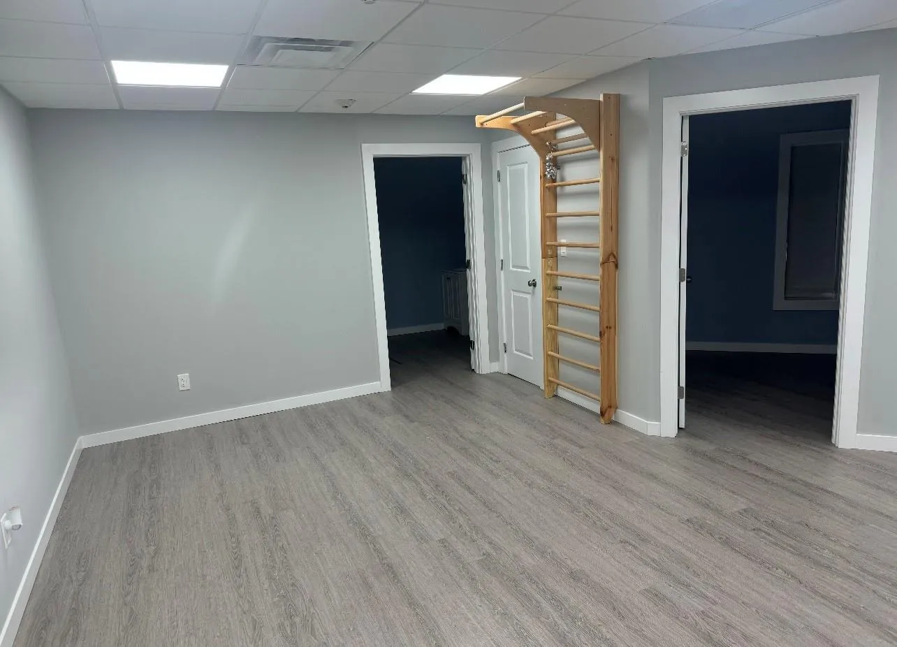 Spare room with visible vents, baseboards, and wood finished floors Spare room with visible vents, baseboards, and wood finished floors