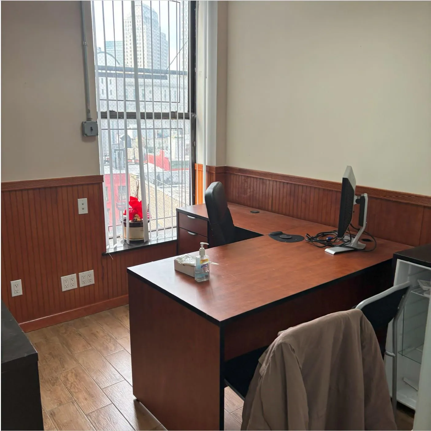 Office featuring a healthy amount of sunlight, a wainscoted wall, and wood walls Office featuring a healthy amount of sunlight, a wainscoted wall, and wood walls
