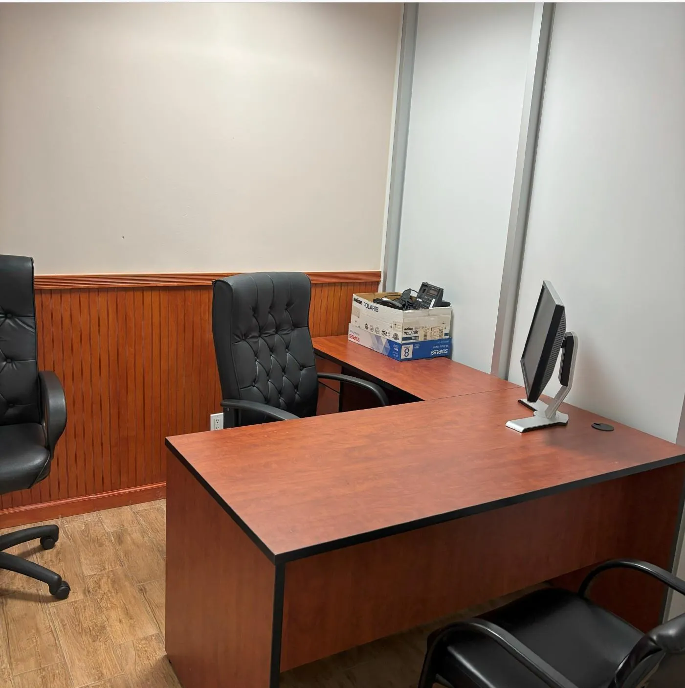 Office area featuring a wainscoted wall, light wood-style flooring, and wood walls Office area featuring a wainscoted wall, light wood-style flooring, and wood walls