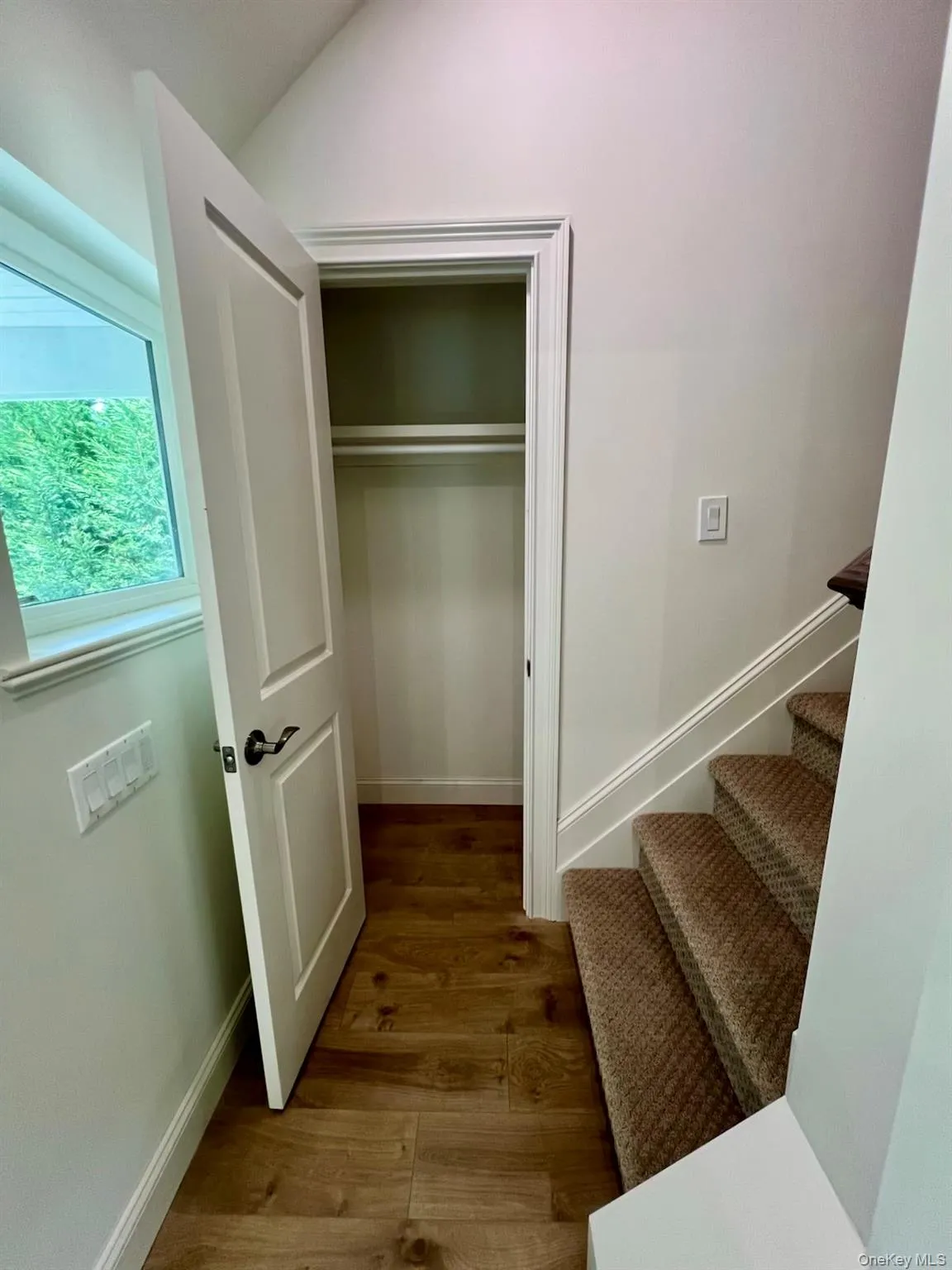 View of closet & carpeted stairs. View of closet & carpeted stairs.