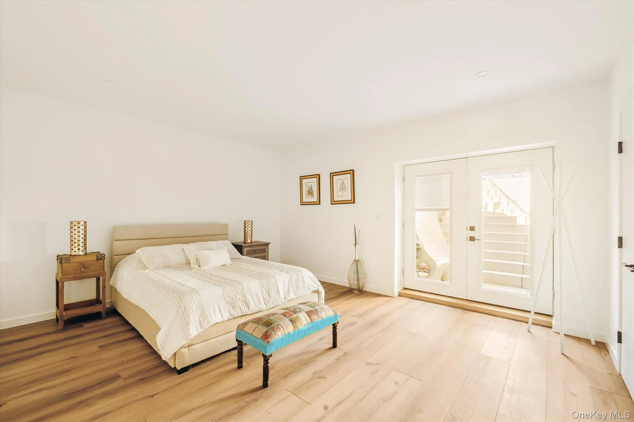 Bedroom with light wood-type flooring and baseboards Bedroom with light wood-type flooring and baseboards