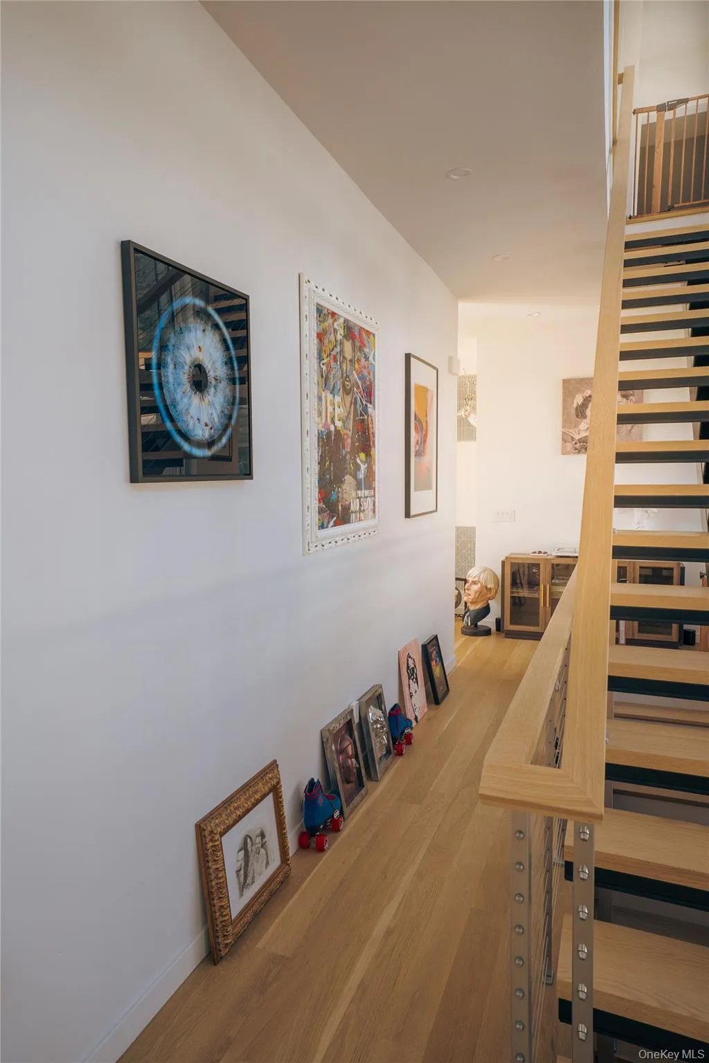 Hall with stairway and wood finished floors Hall with stairway and wood finished floors