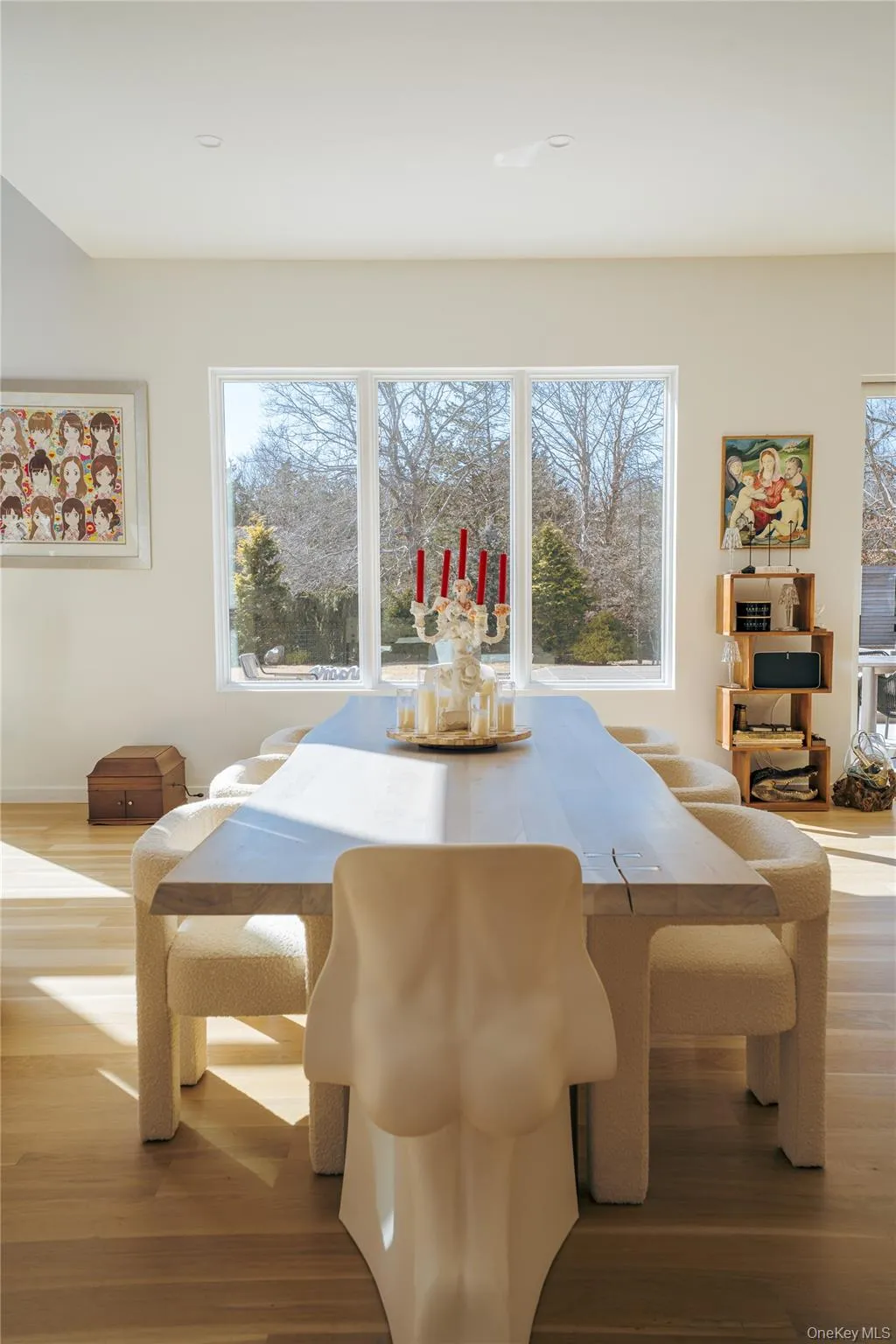 Dining space with plenty of natural light and wood finished floors Dining space with plenty of natural light and wood finished floors
