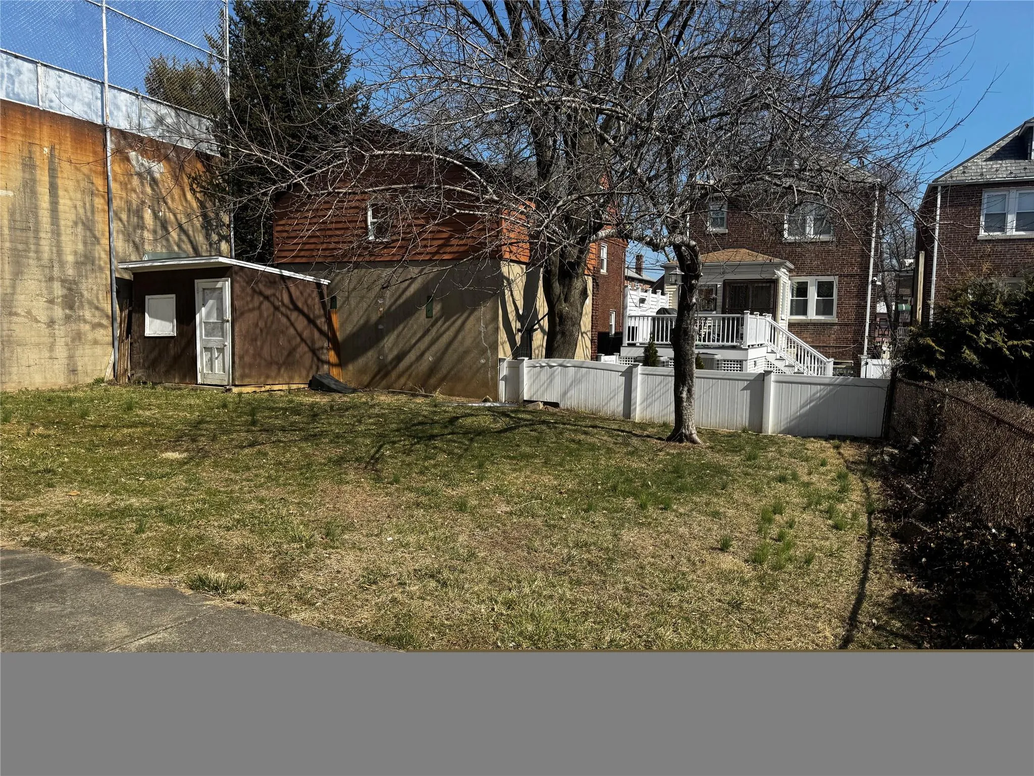 View of yard with fence private yard, a storage shed, and an outdoor structure View of yard with fence private yard, a storage shed, and an outdoor structure