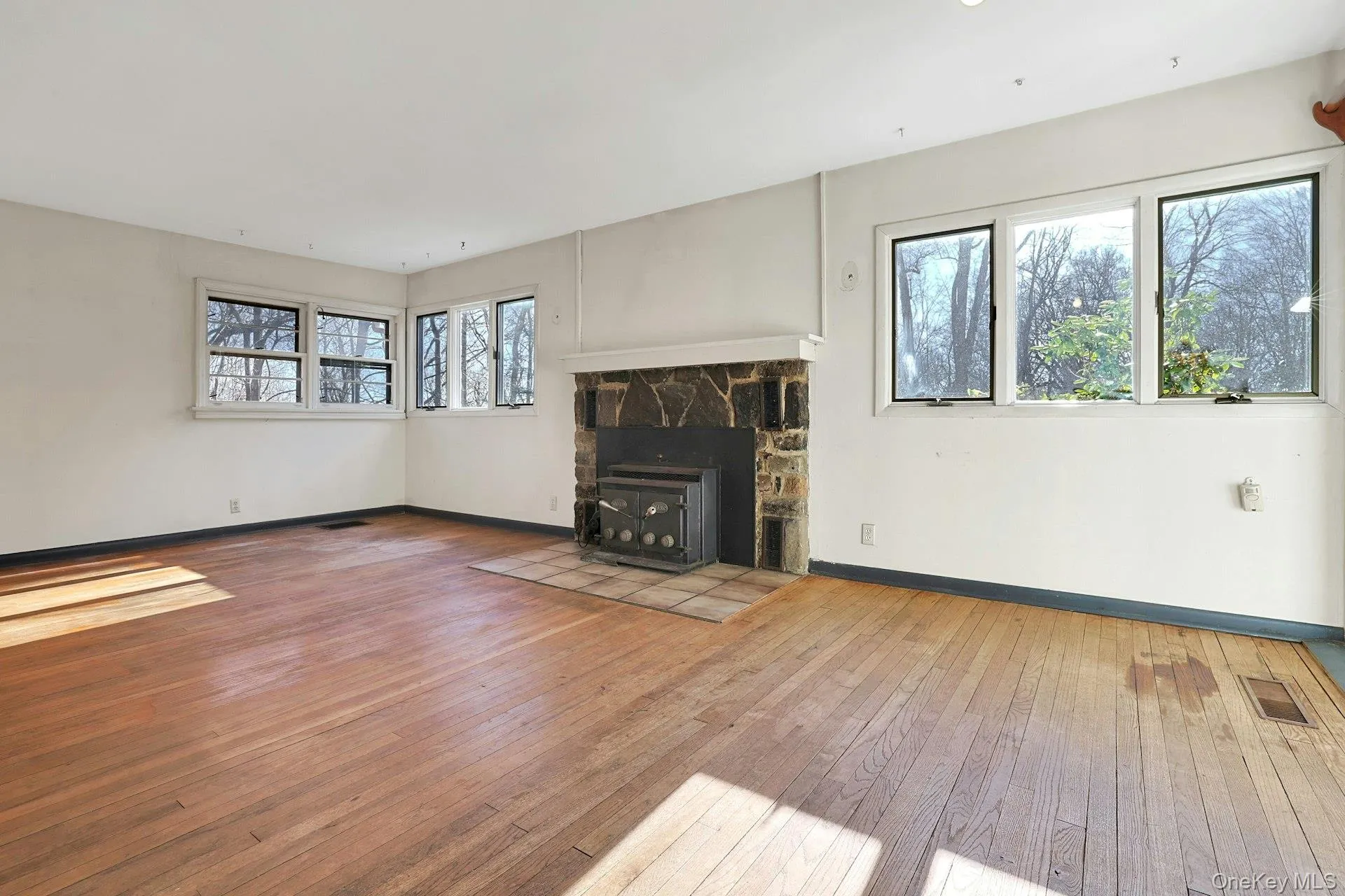 The stone surrounded wood-burning stove is at the heart of the living room - a perfect spot for winter nights. The stone surrounded wood-burning stove is at the heart of the living room - a perfect spot for winter nights.