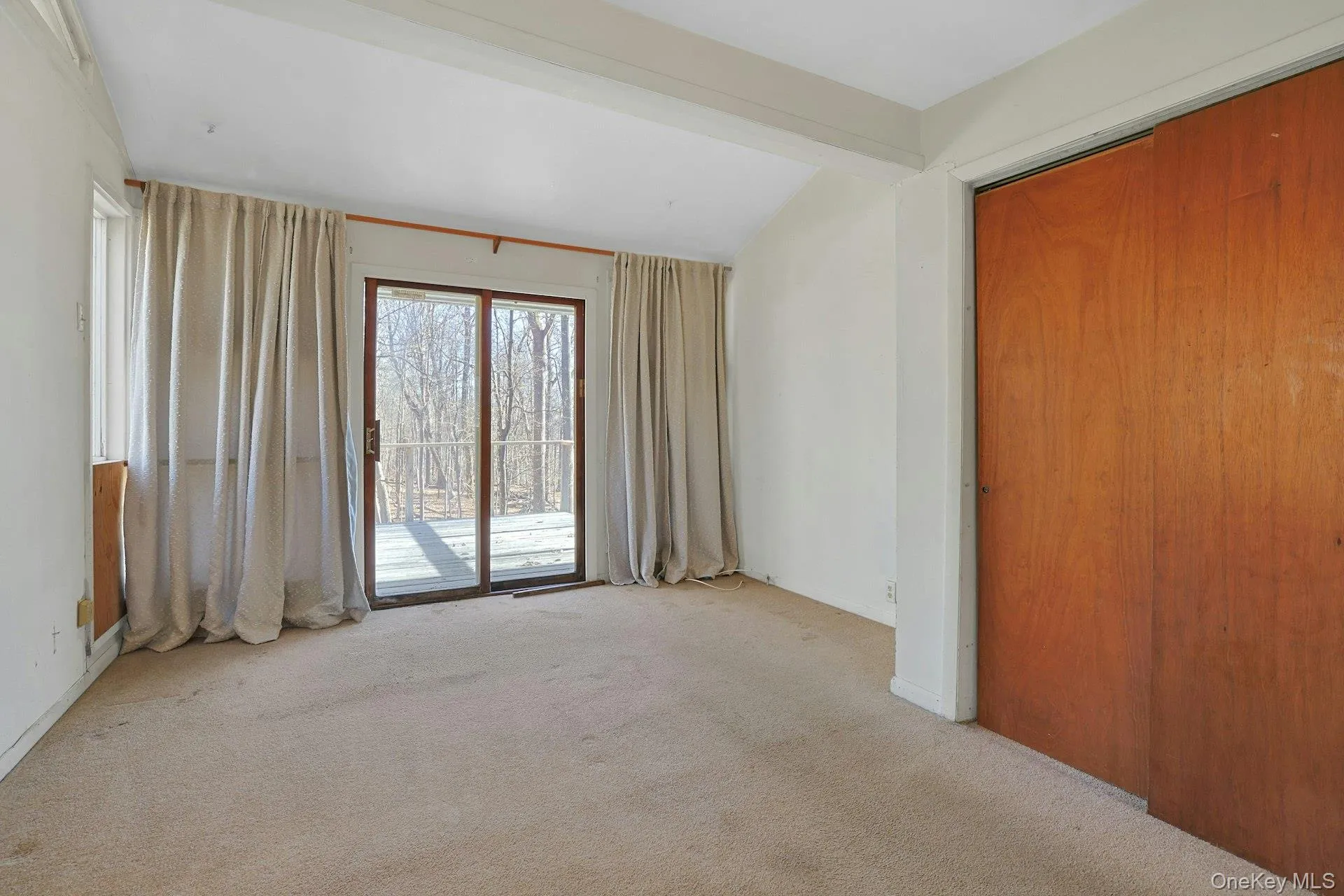 The primary bedroom features two closets, sliding doors out to a private deck and an en-suite bathroom. The primary bedroom features two closets, sliding doors out to a private deck and an en-suite bathroom.