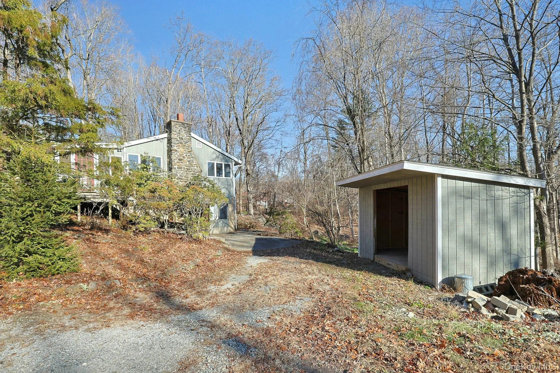 The large shed has plenty of space to store gardening equipment. It could also be a great spot for a garage. The large shed has plenty of space to store gardening equipment. It could also be a great spot for a garage.