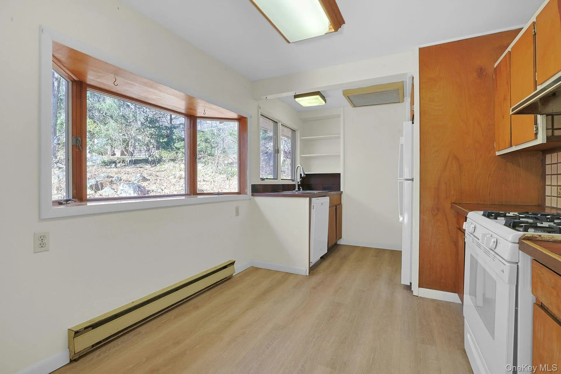 This bay window looks out to the grounds and to distant neighbors - you have privacy in this home, but are never far from civilization. This bay window looks out to the grounds and to distant neighbors - you have privacy in this home, but are never far from civilization.